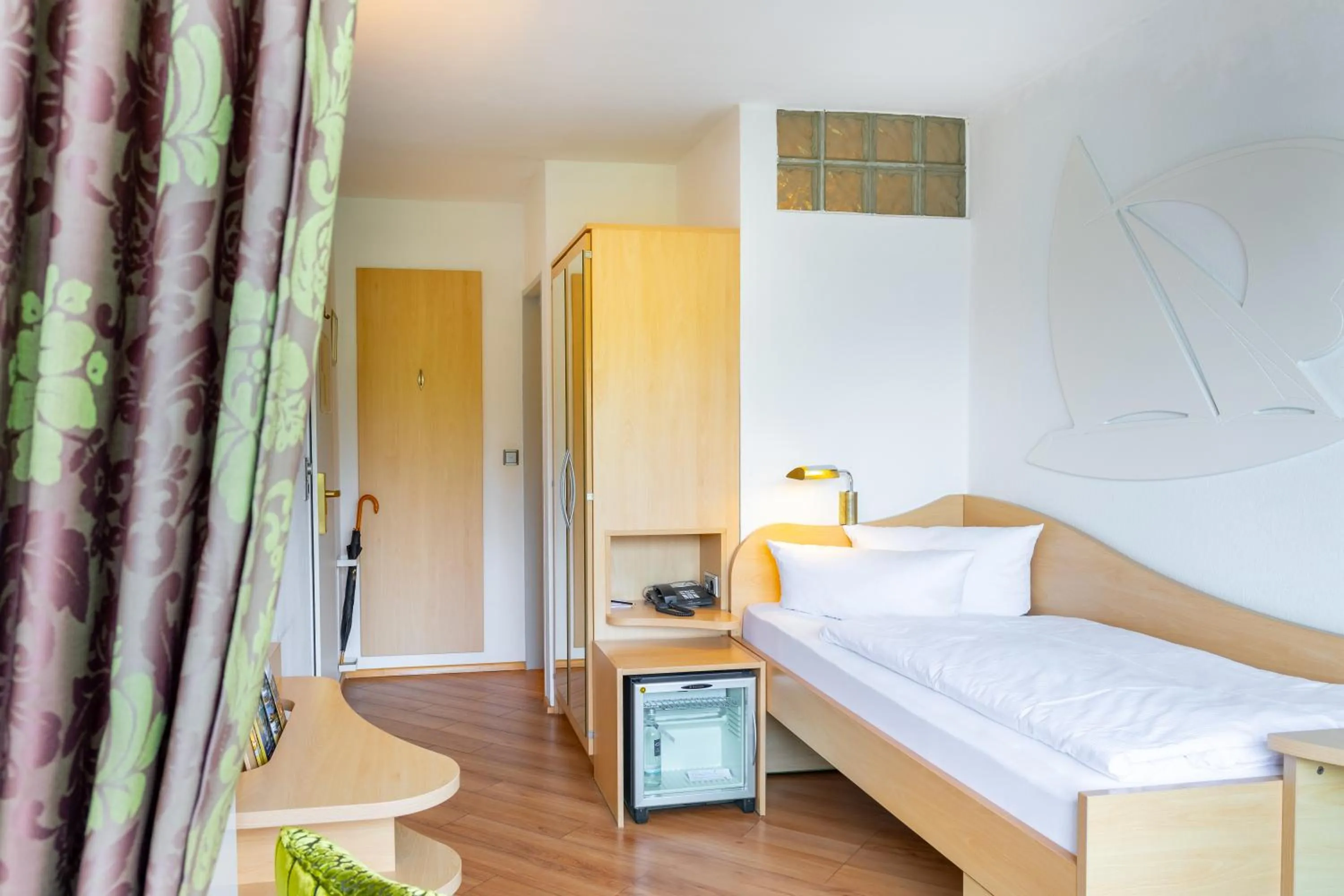 Photo of the whole room, Bed in Seehotel Fährhaus