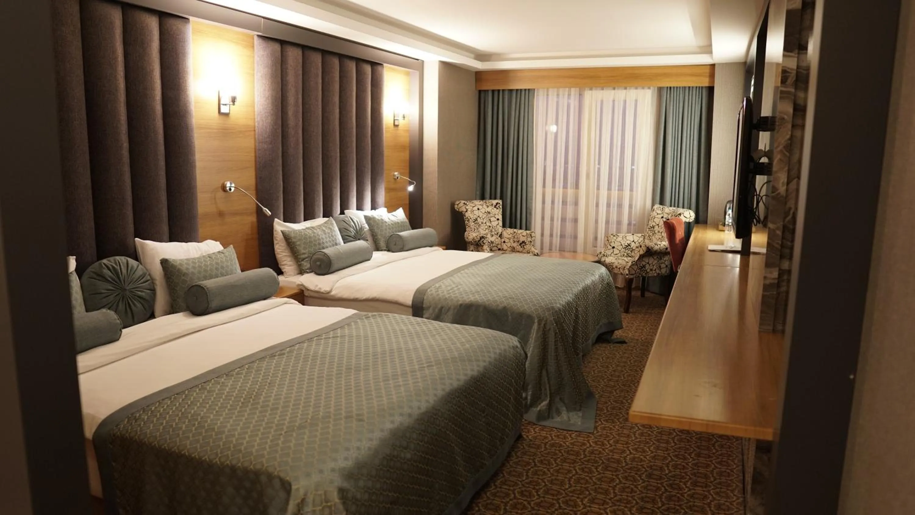 Bed in Green Prusa Hotel