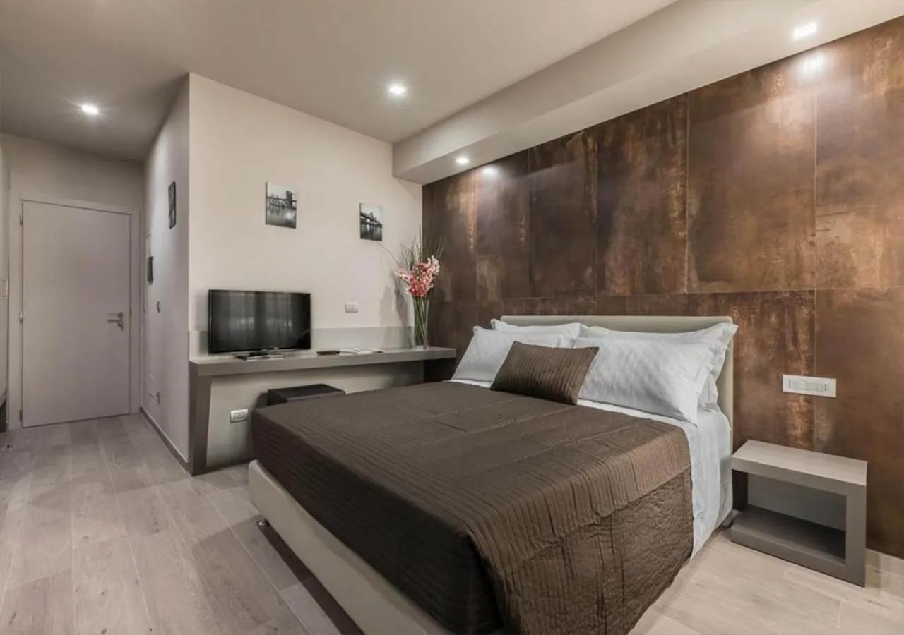 Bed in Astoria Deluxe rooms