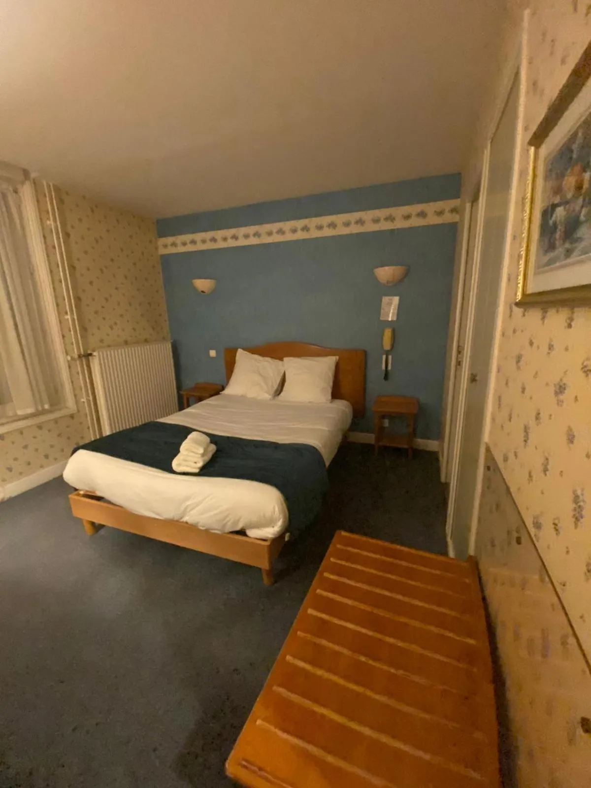 Bed in Logis Grand Hôtel De L'Europe