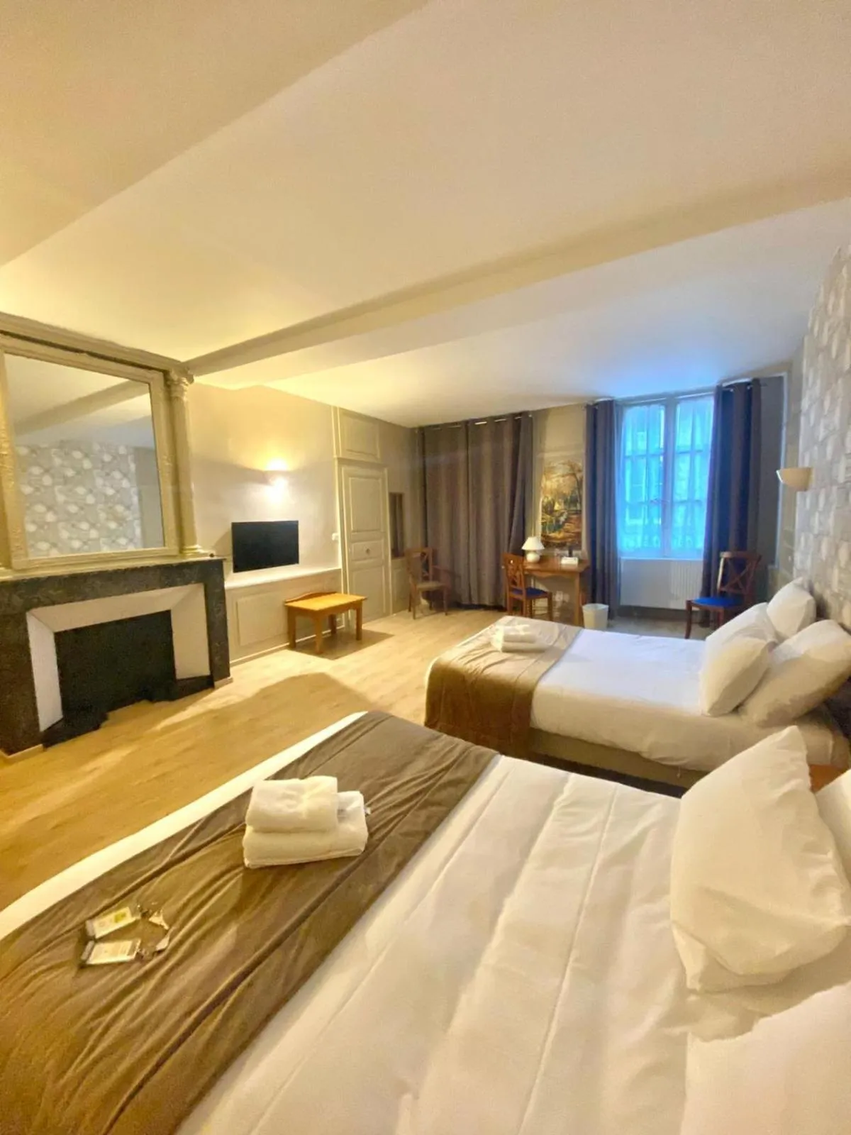 Bed in Logis Grand Hôtel De L'Europe