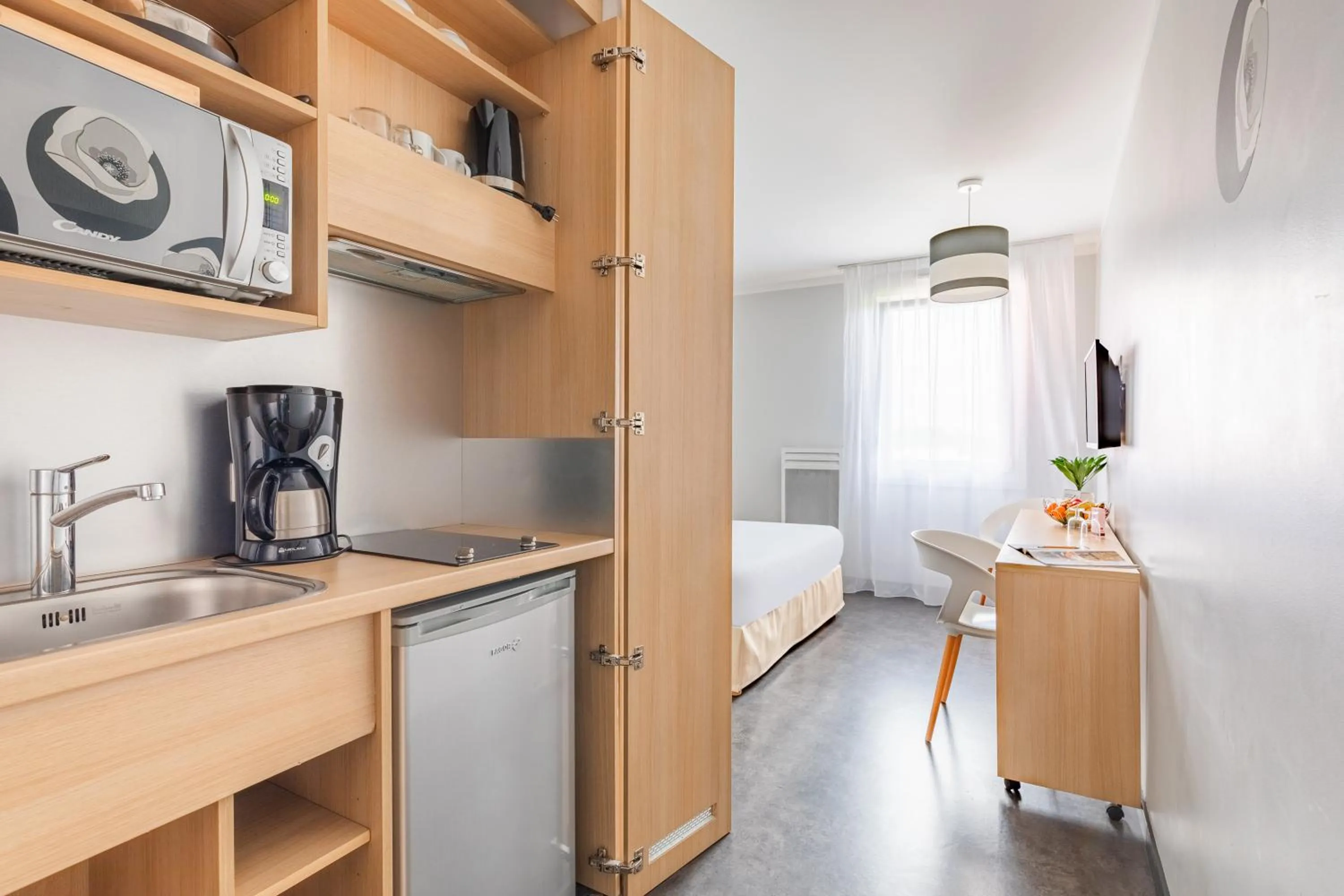 Kitchen or kitchenette in Appart'City Classic Reims Parc des Expositions