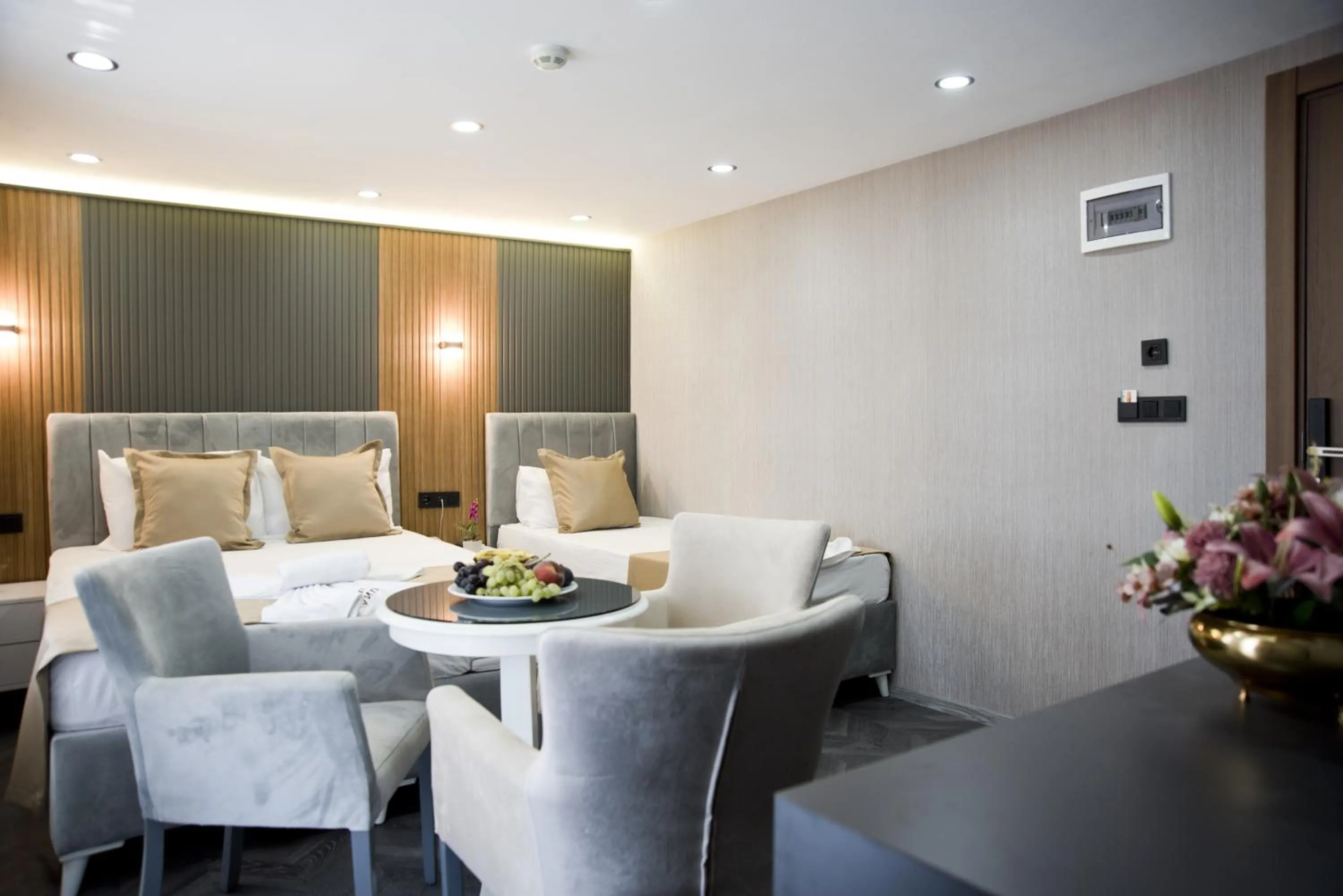 Seating area, Bed in Grand Bagoz Hotel