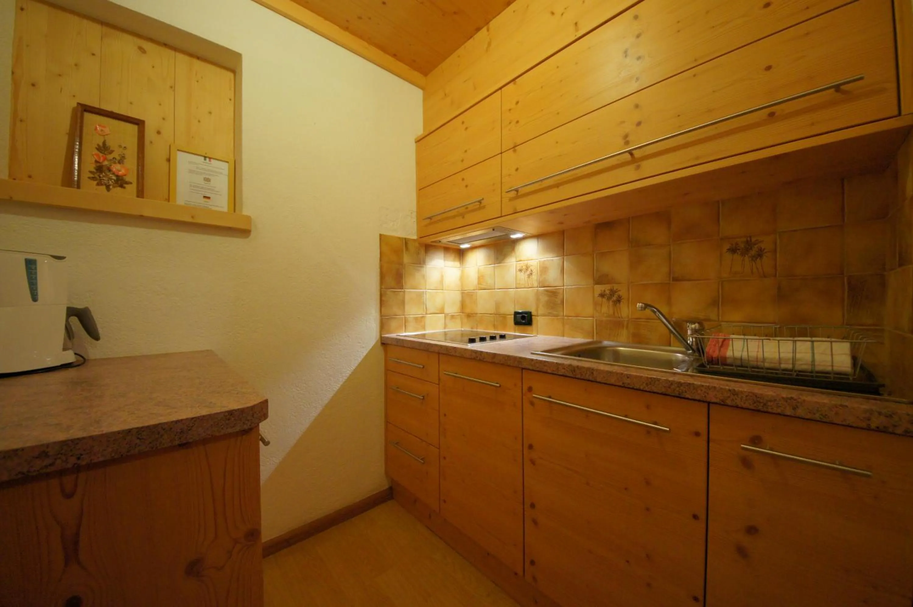 Kitchen or kitchenette in Garnì Sirio