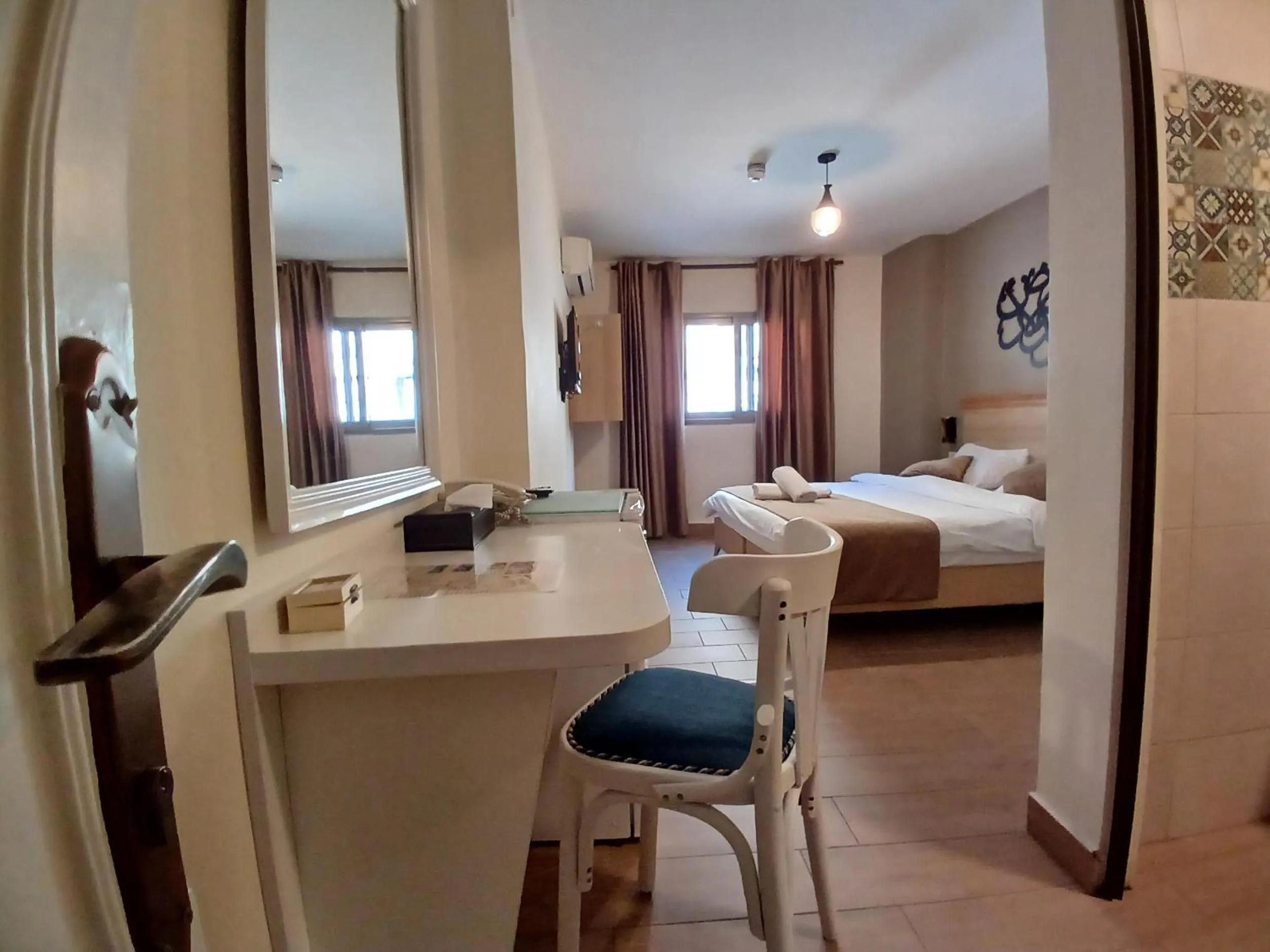 Bed in Layaali Amman Hotel