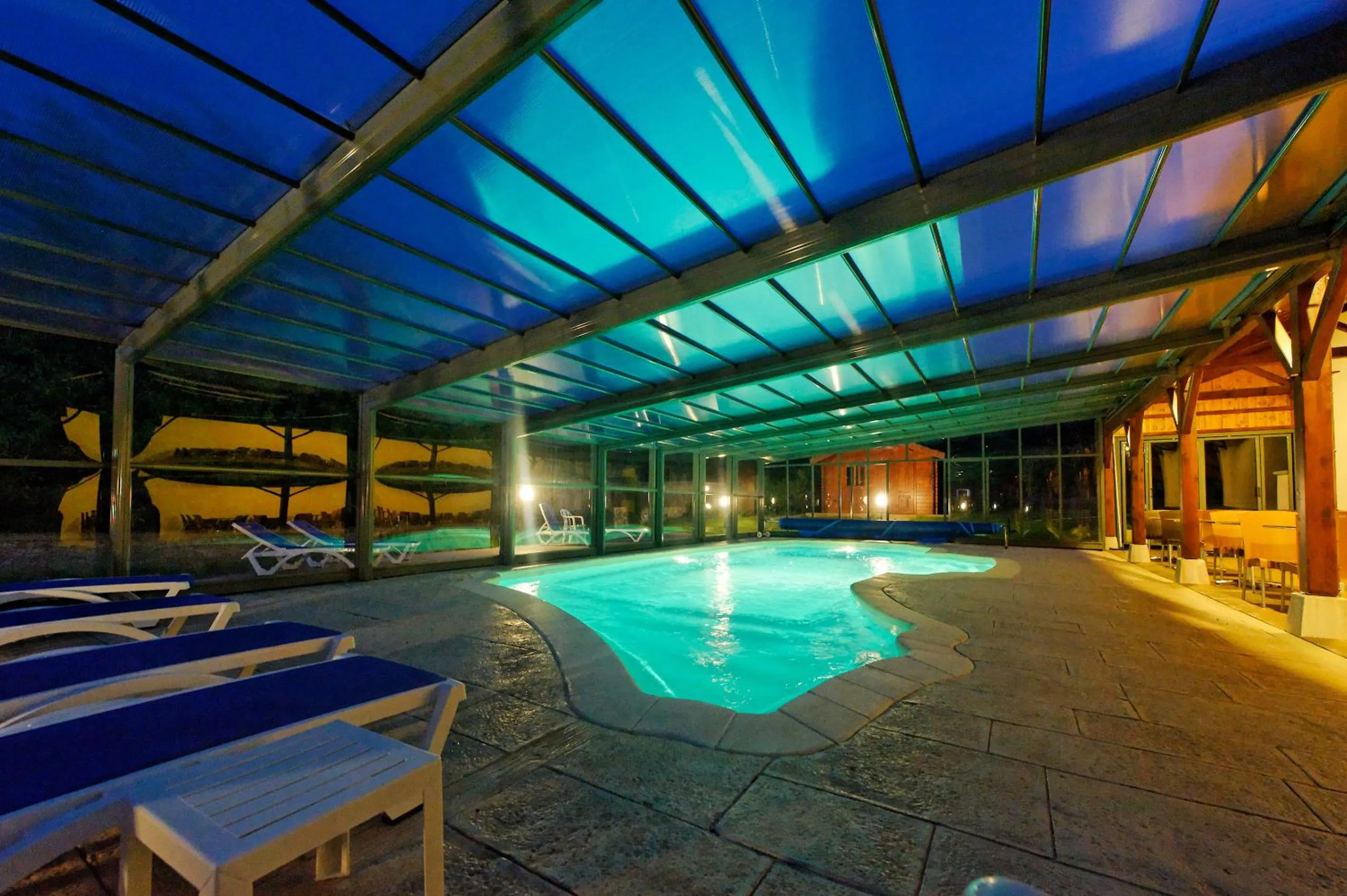 Swimming pool in Logis Des Trois Maures