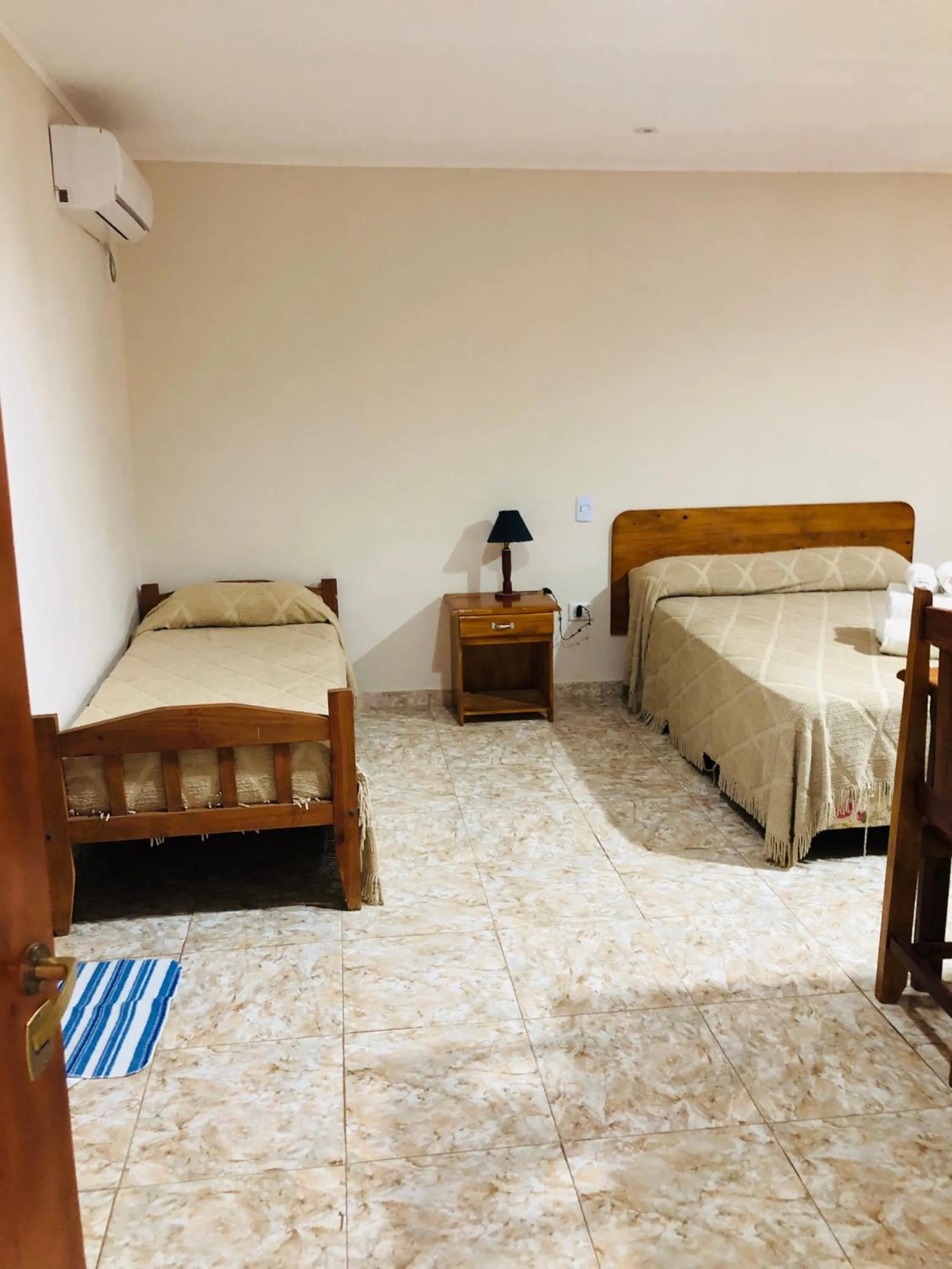 Bed in La Familia Hotel