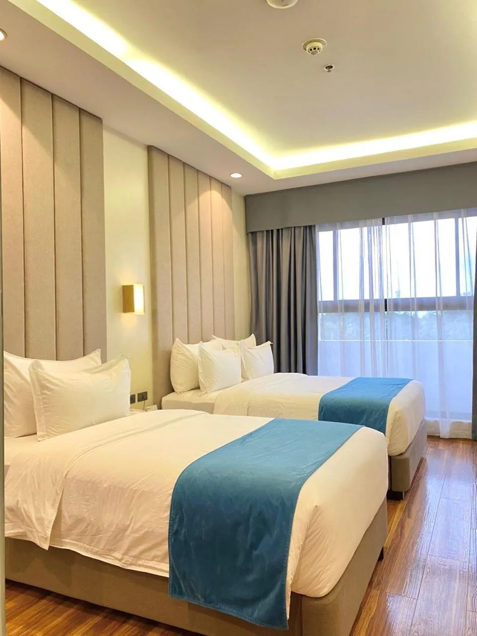 Bed in Bravo Tanauan Hotel