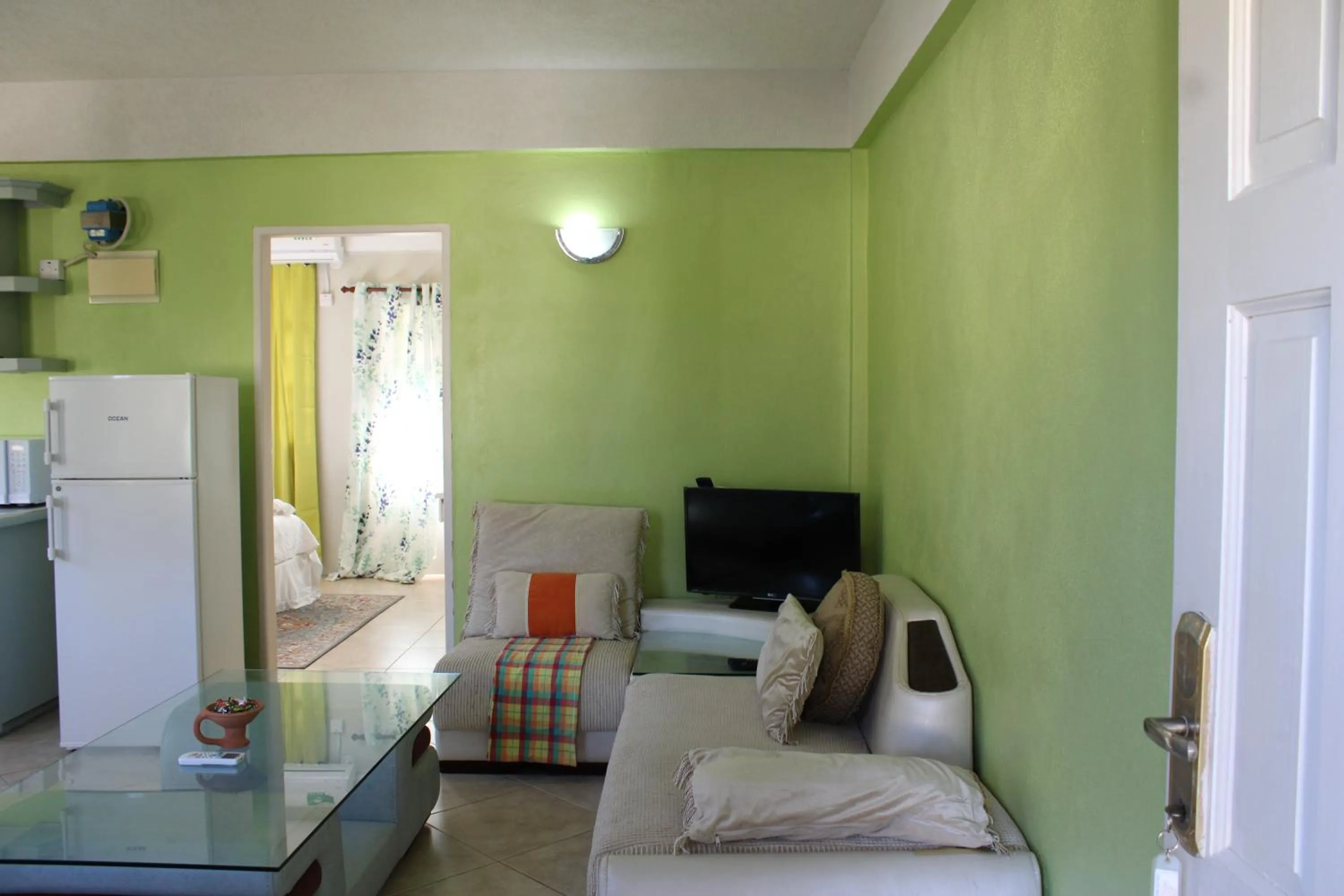 Seating area, Bed in Rejens Hotel