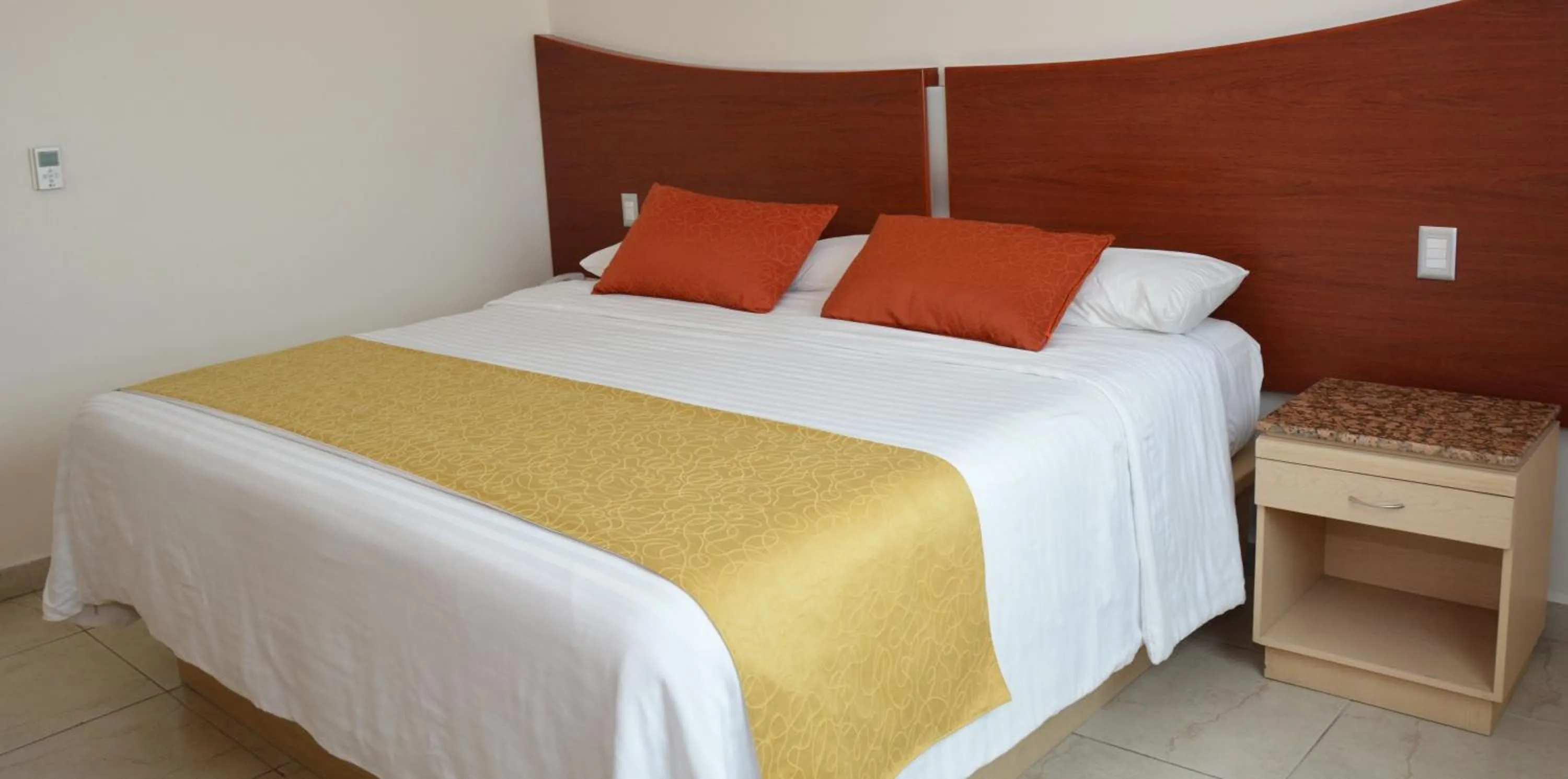 Bed in Hotel Magico Inn