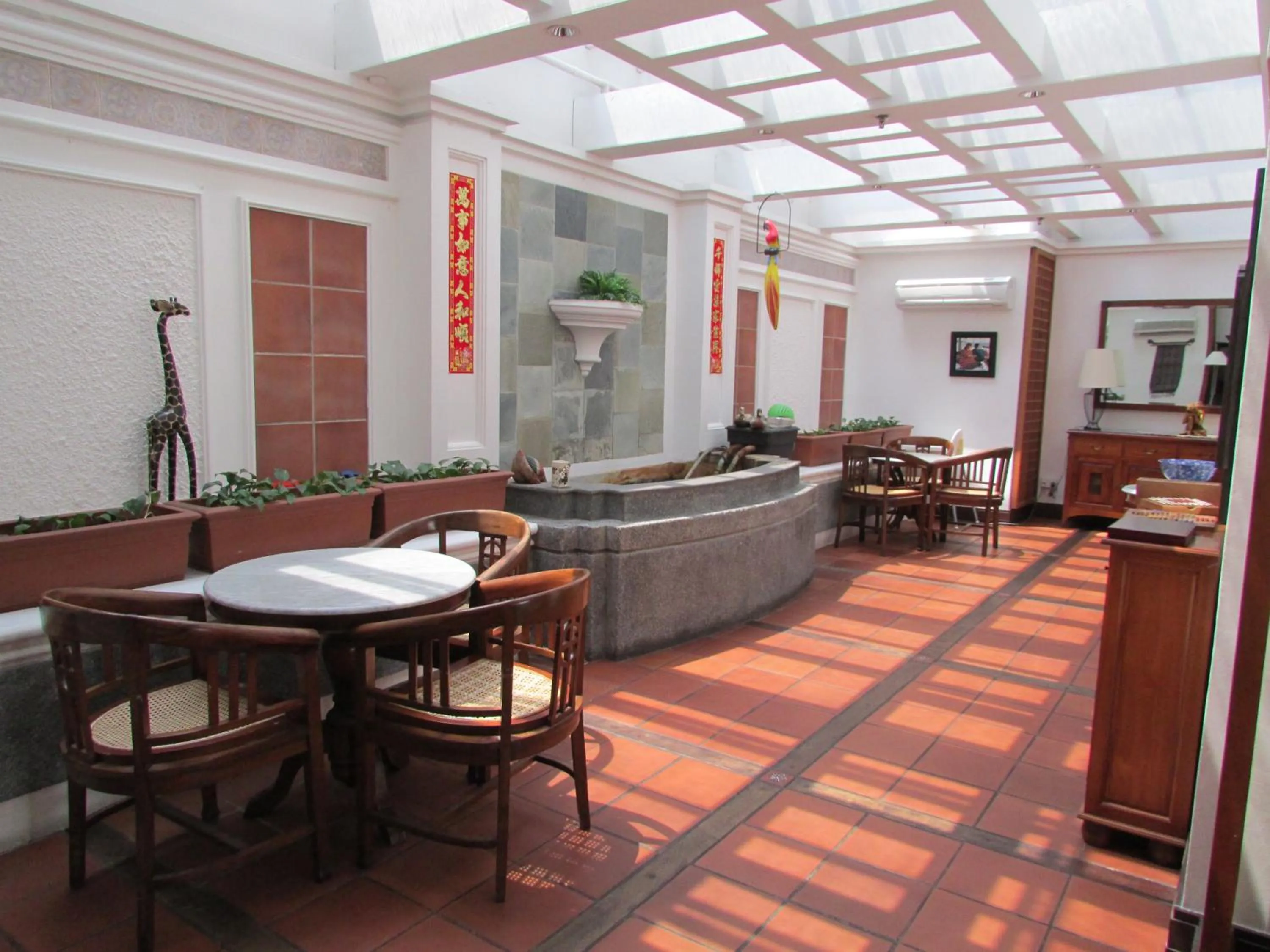 Communal lounge/ TV room in Perak Hotel