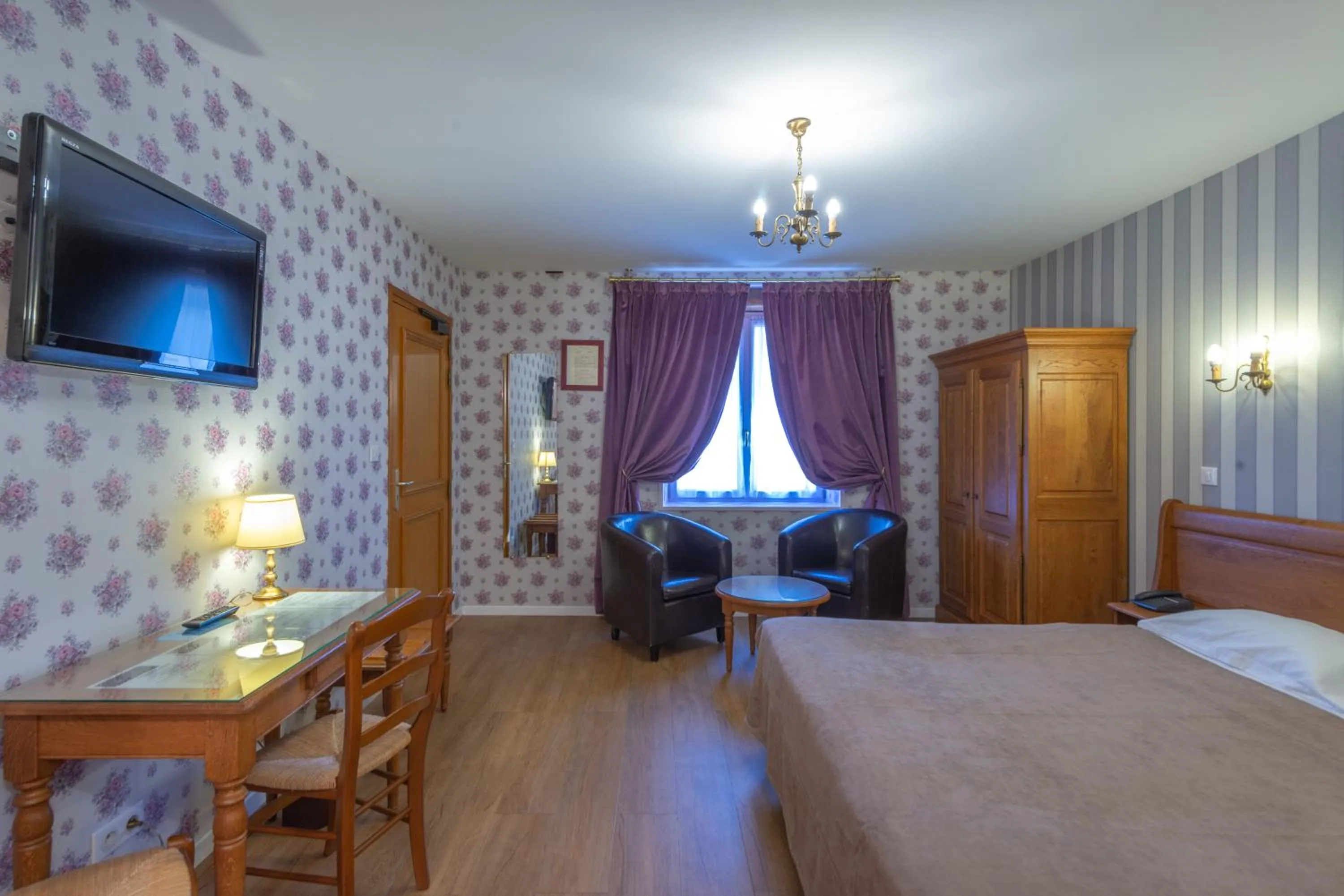 Photo of the whole room, Bed in Logis Hotel de La Cloche