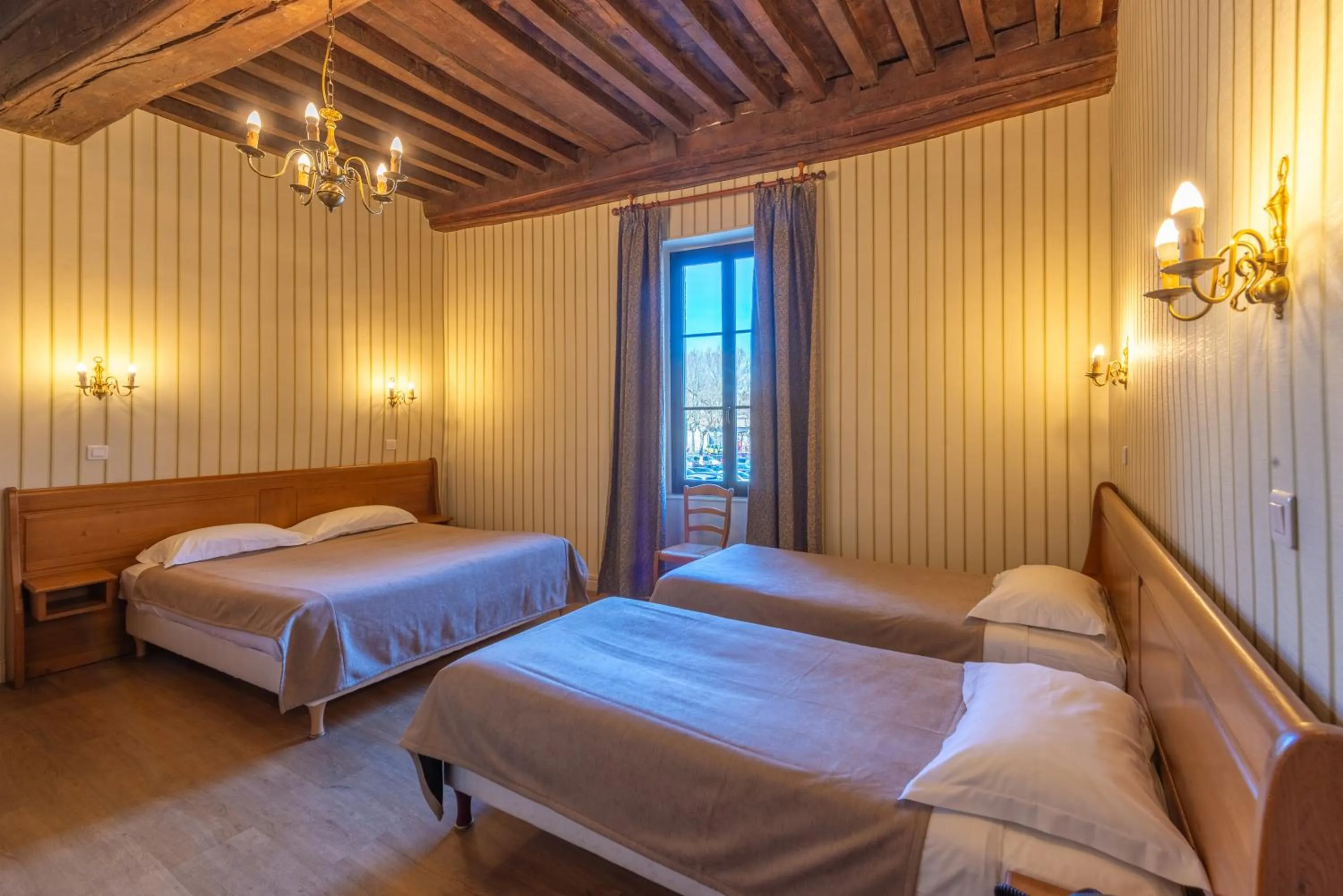 Photo of the whole room, Bed in Logis Hotel de La Cloche