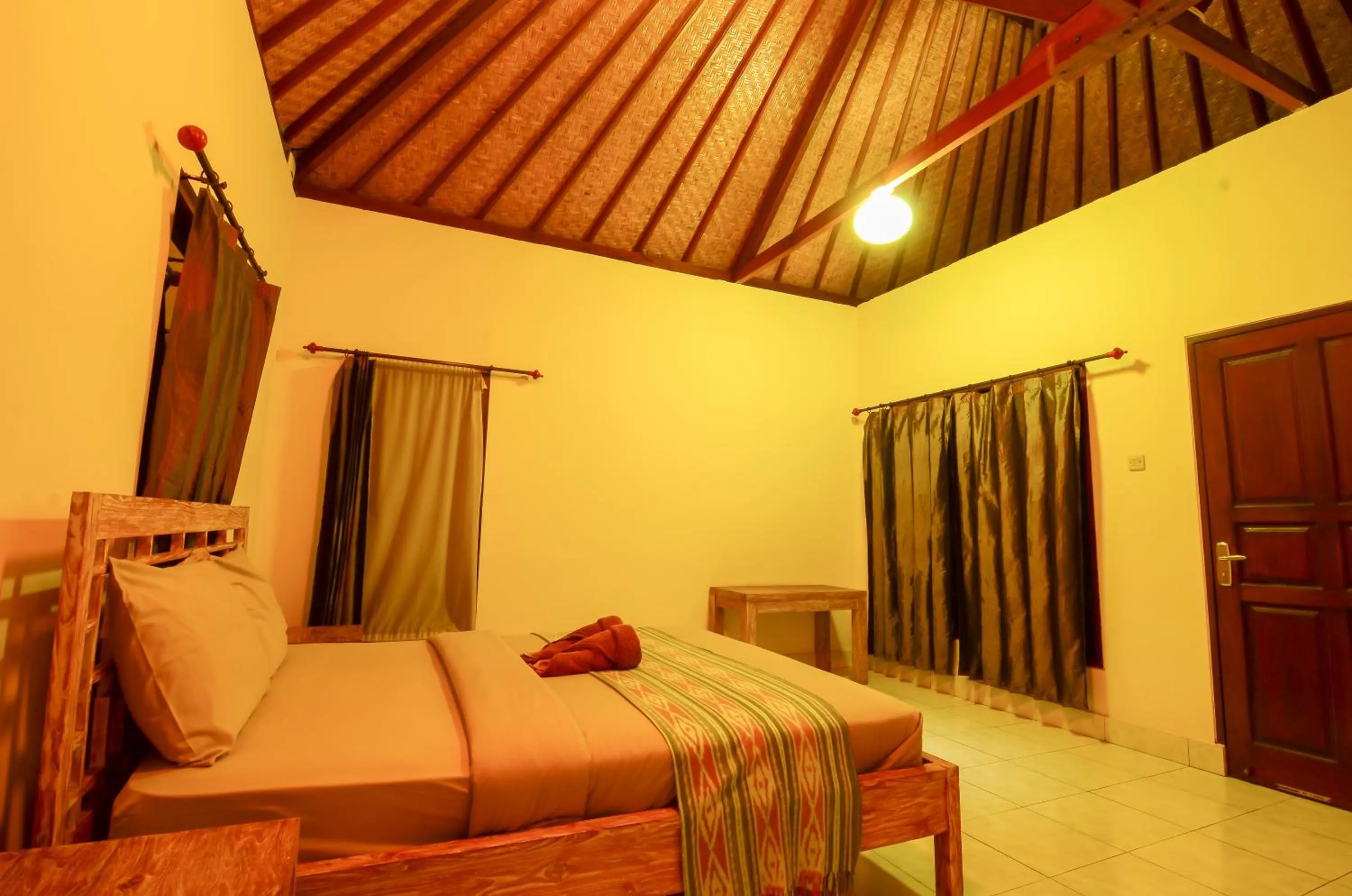 Bed in Mapa Lake View Bungalow