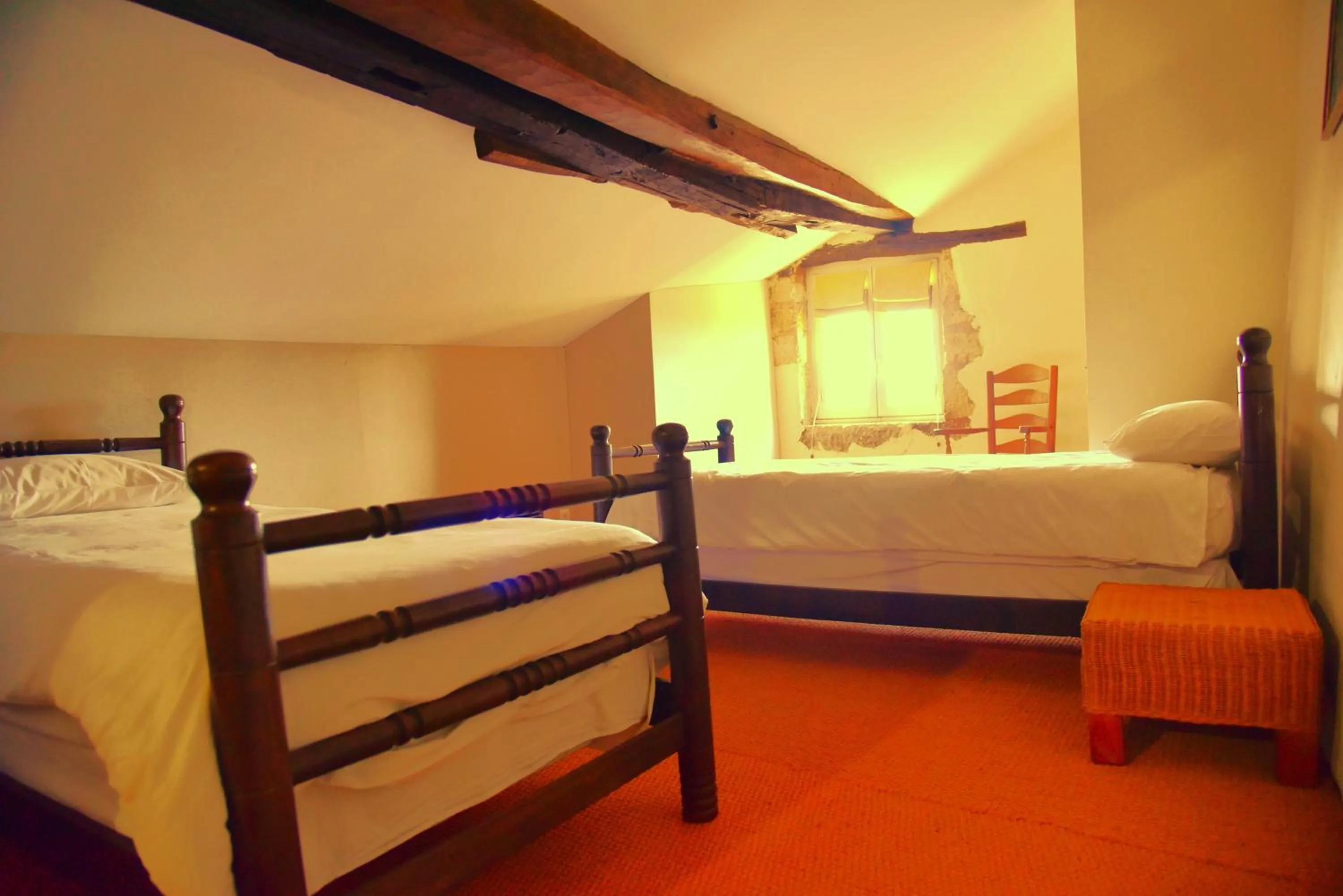 Bed in Logis Hôtel Le Boudoir