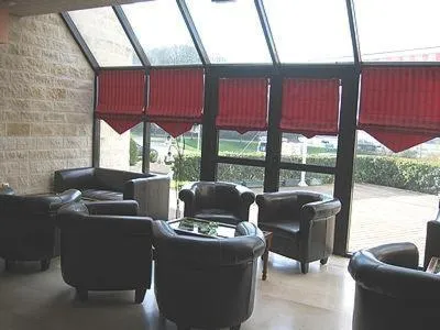 Communal lounge/ TV room in Auberge De Bourgogne