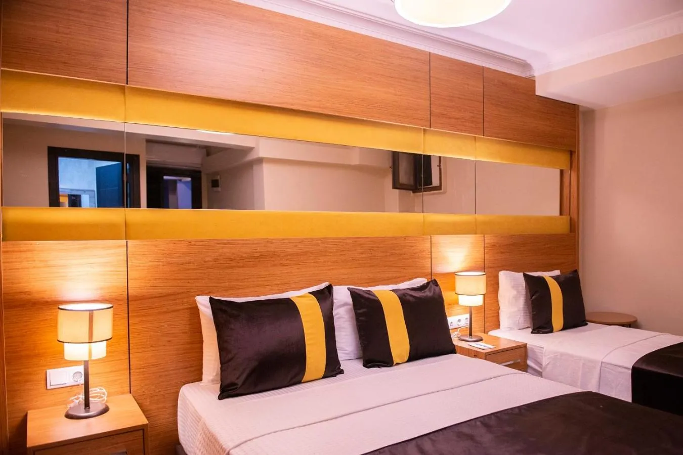 Bed in KARAMANS SİRKECİ SUİTES HOTEL