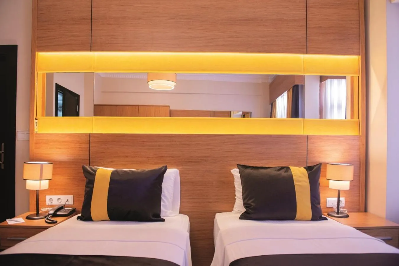 Bed in KARAMANS SİRKECİ SUİTES HOTEL