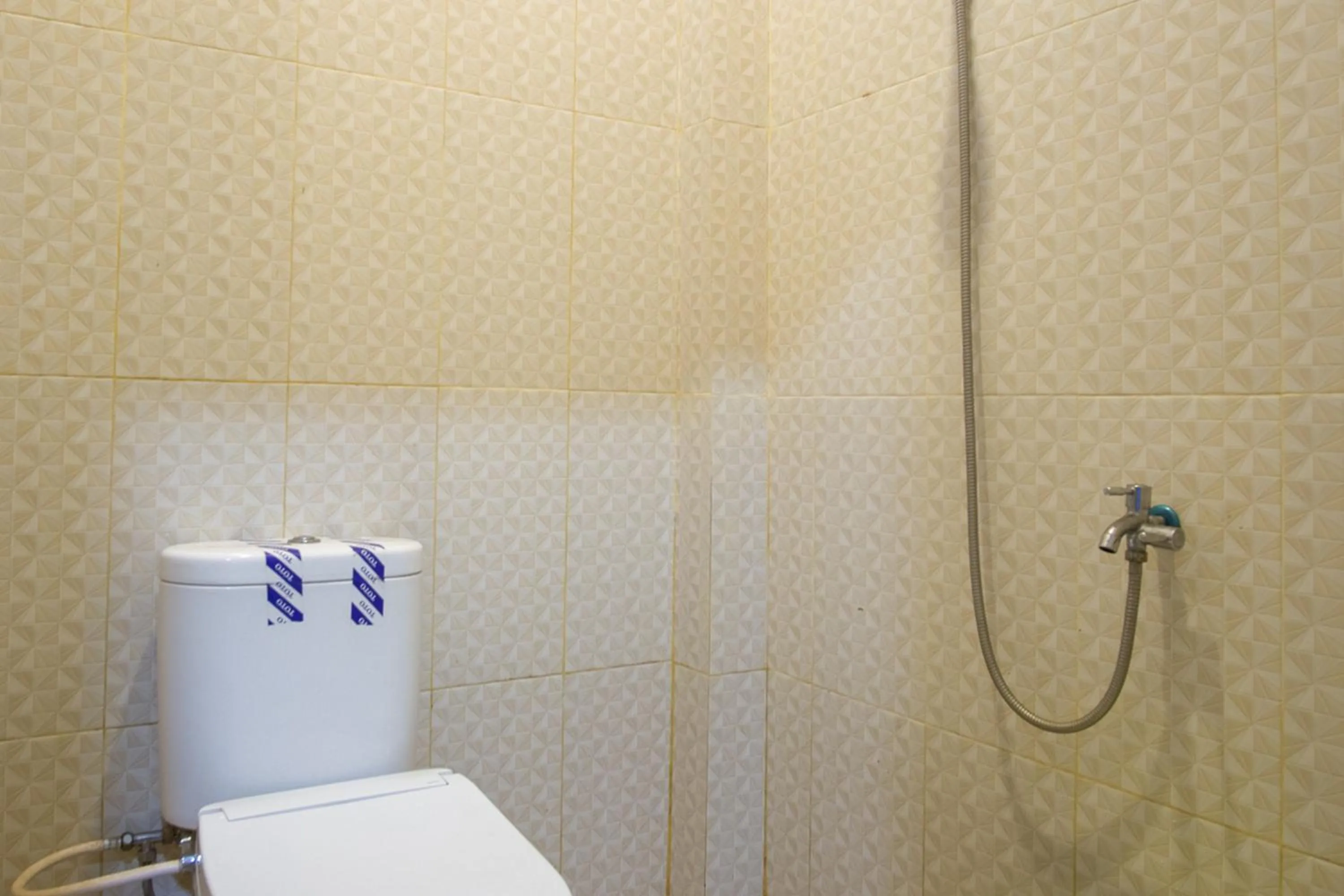 Bathroom in RedDoorz near Taman Kota Ternate