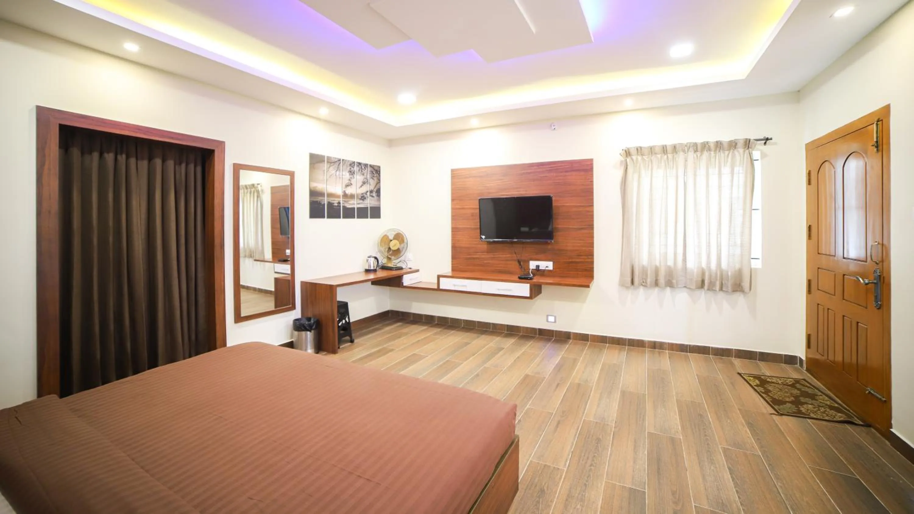 Communal lounge/ TV room, Bed in Aira Residency Kothagiri by Lexstays