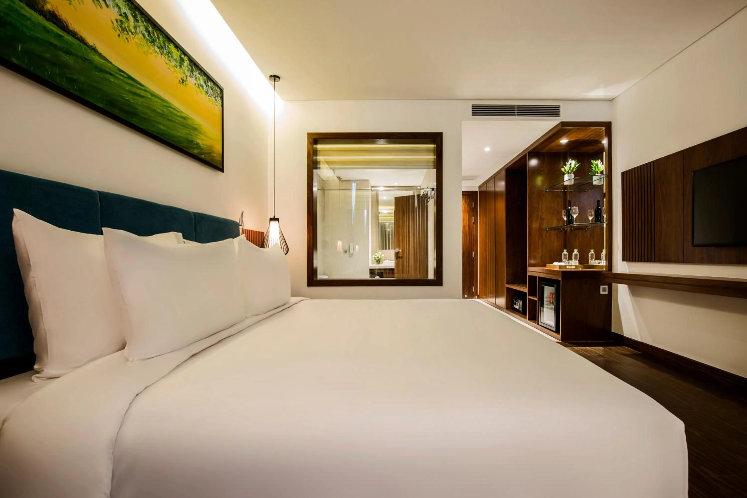 Bed in Maximilan Danang Beach Hotel