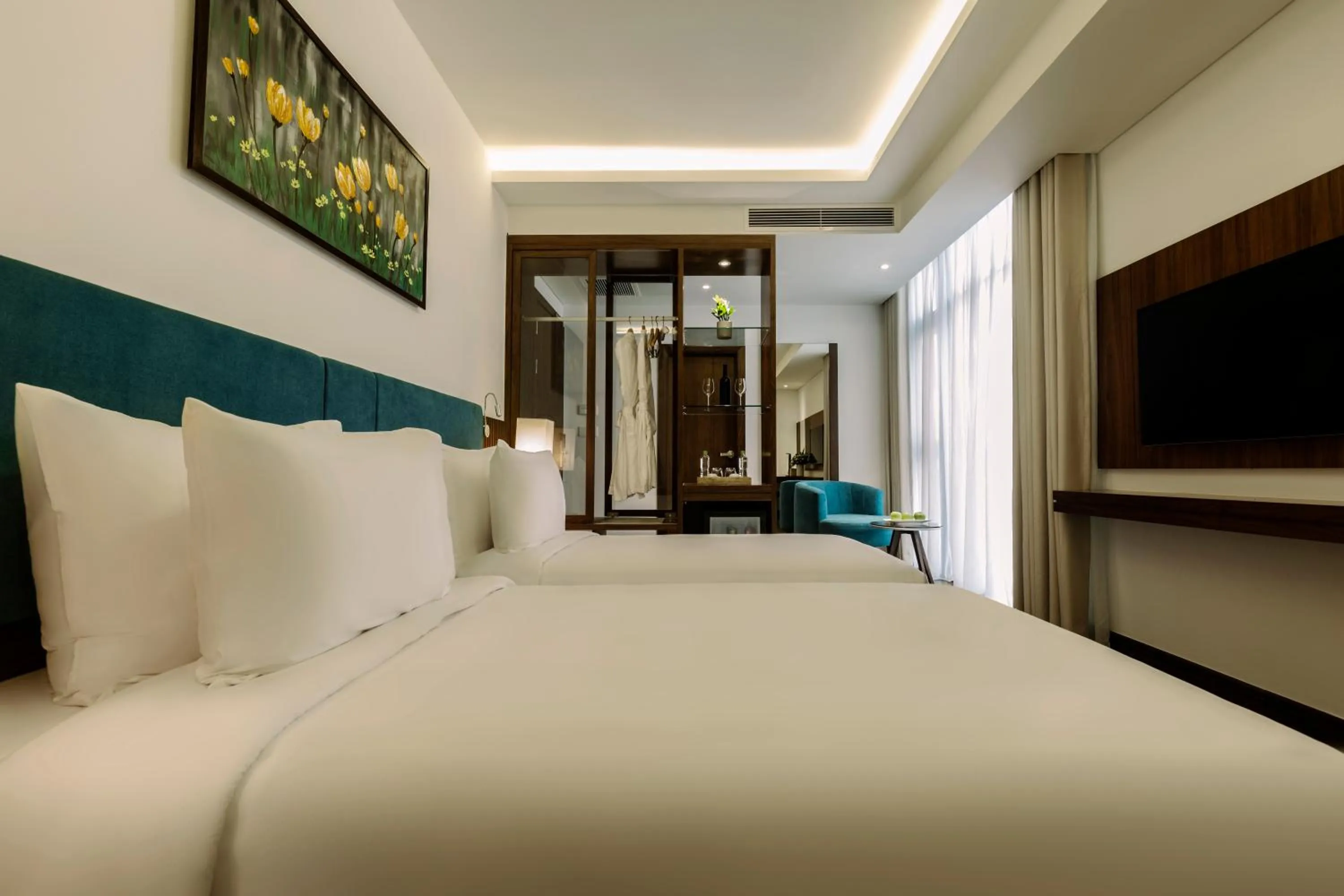 Bed in Maximilan Danang Beach Hotel