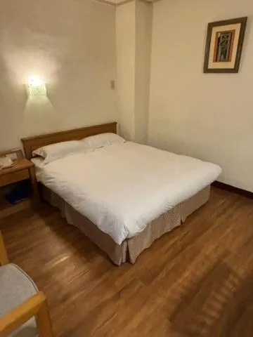 Bed in 金馬大飯店 Riverside Hotel