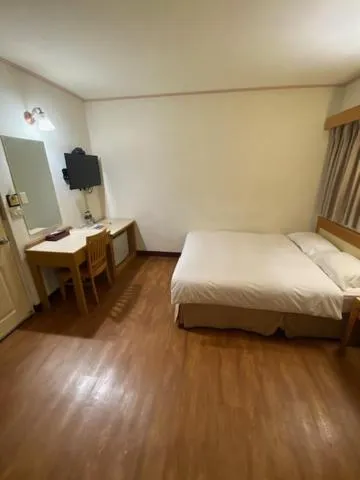 Bed in 金馬大飯店 Riverside Hotel