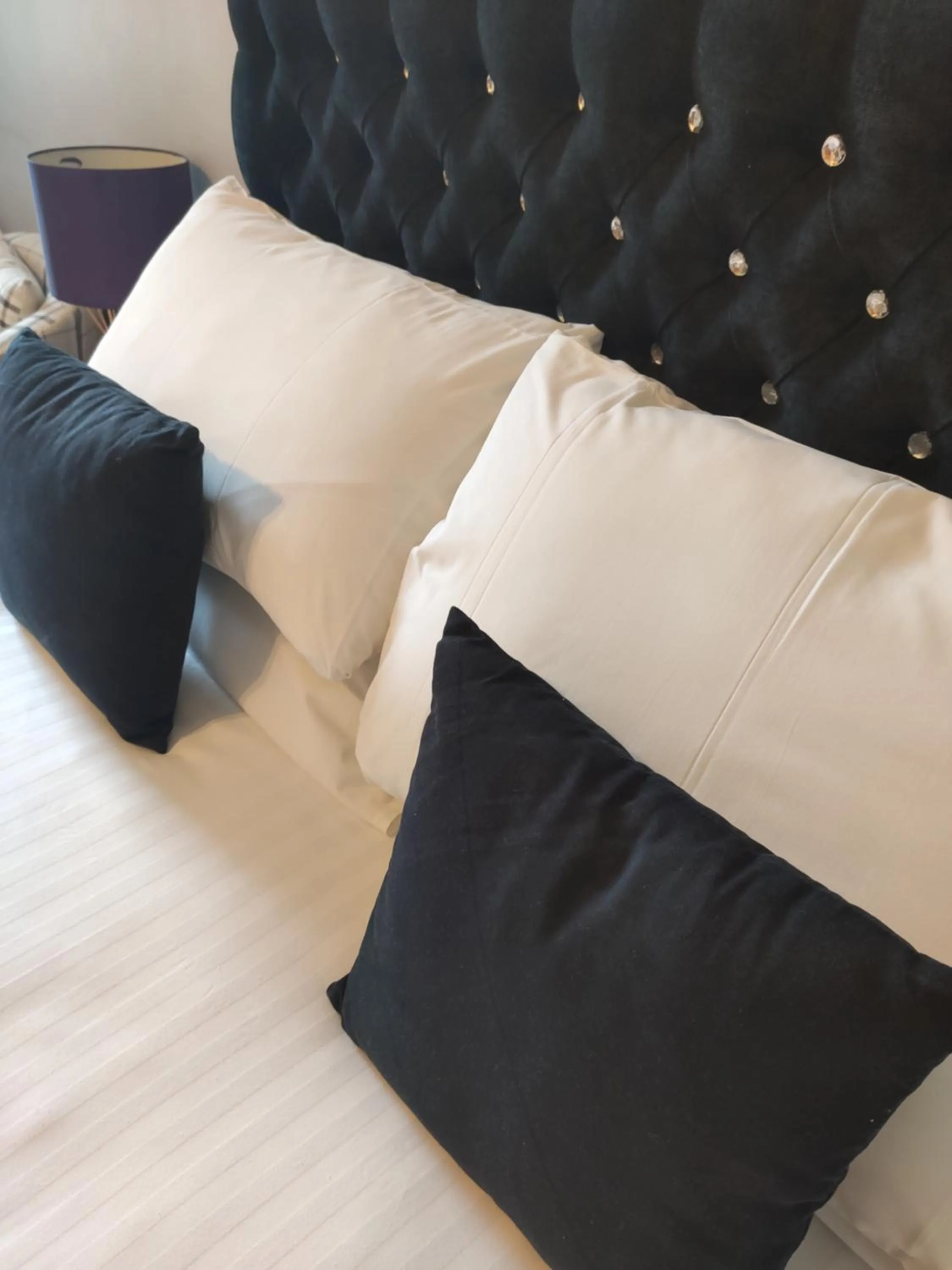 Bed in Q Accommodation