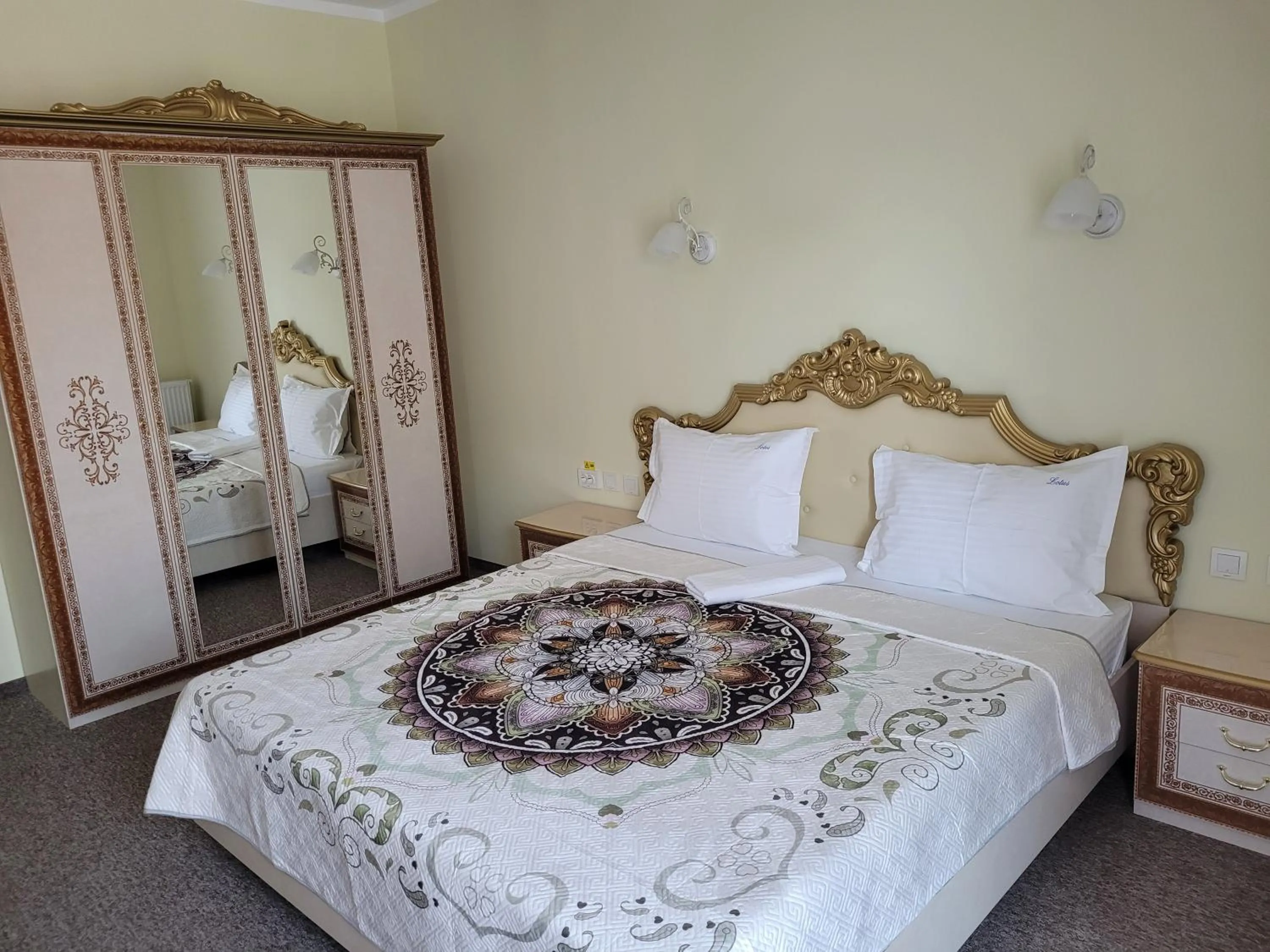 Photo of the whole room, Bed in LOTUS Boutique