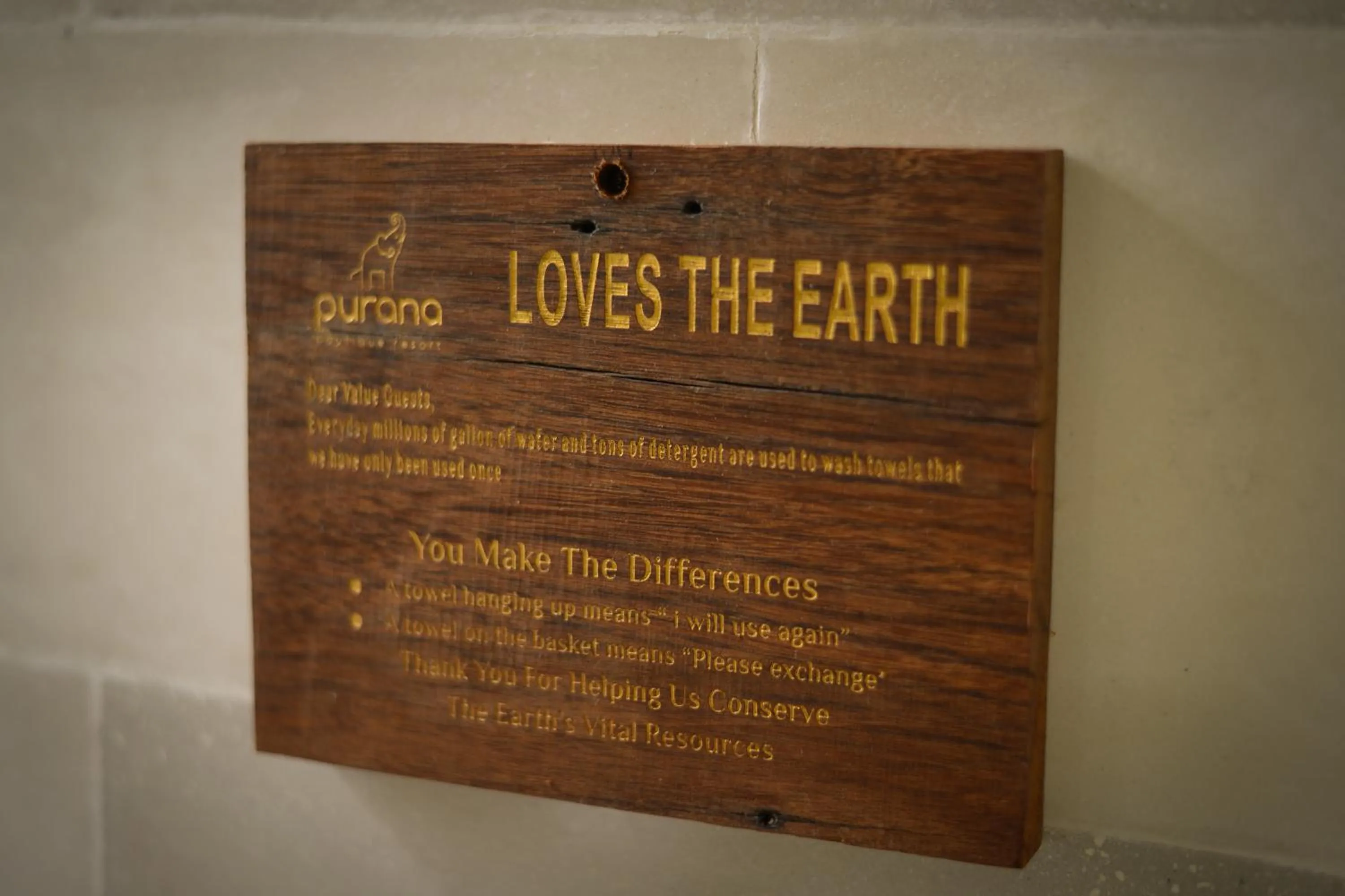 Property logo or sign in Purana Suite Ubud