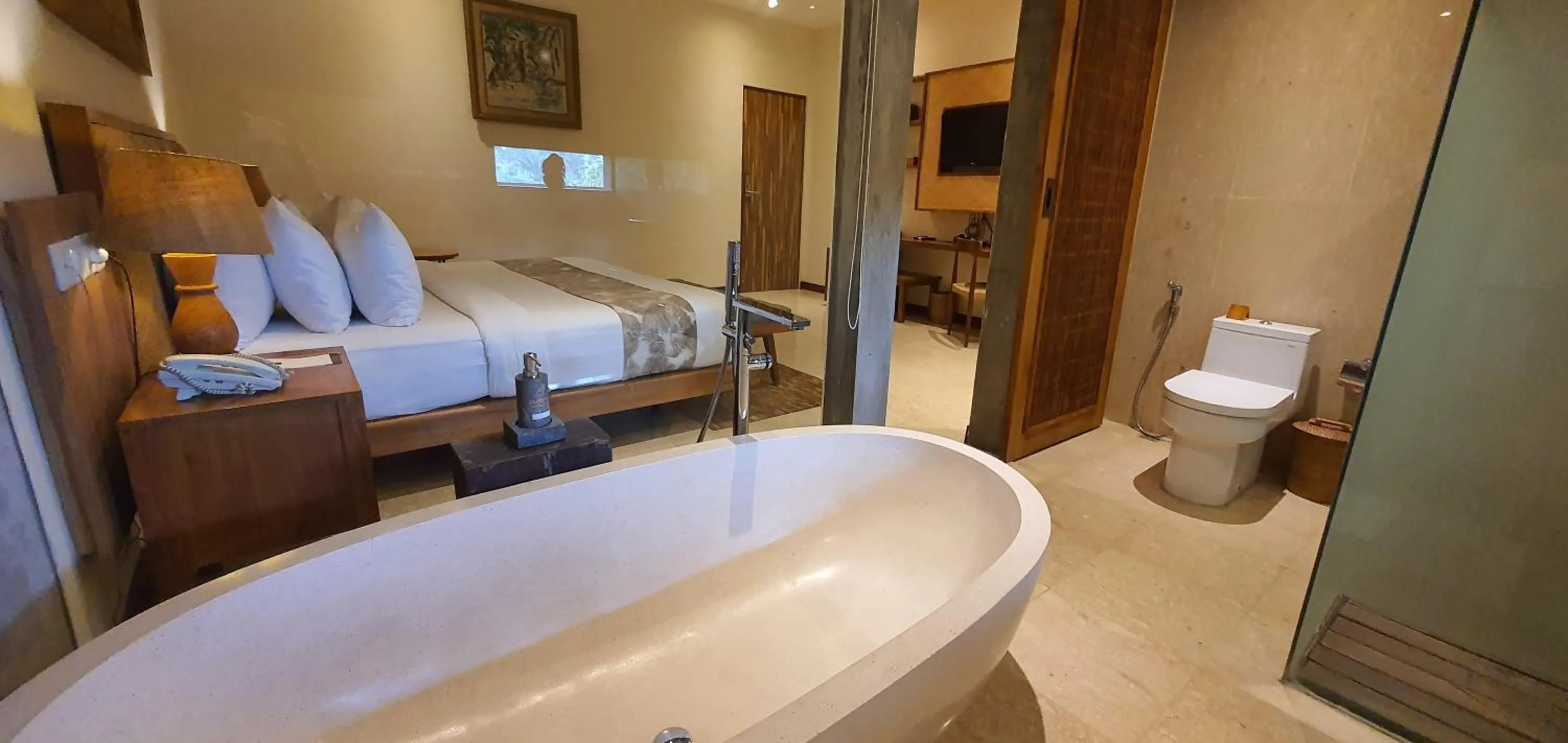 Bathroom, Bed in Purana Suite Ubud