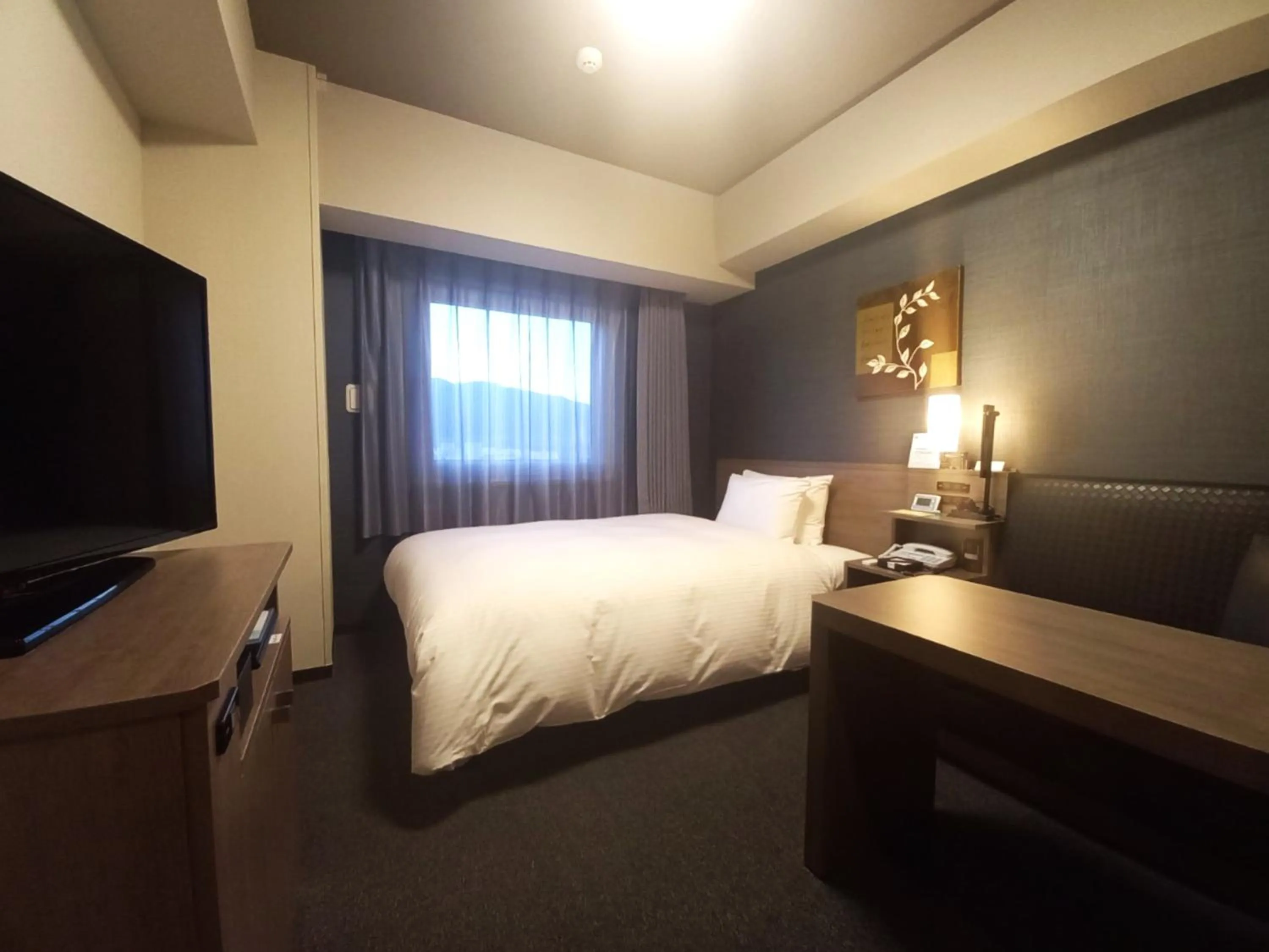 Photo of the whole room, Bed in Hotel Route-Inn Yamanashi Chuo