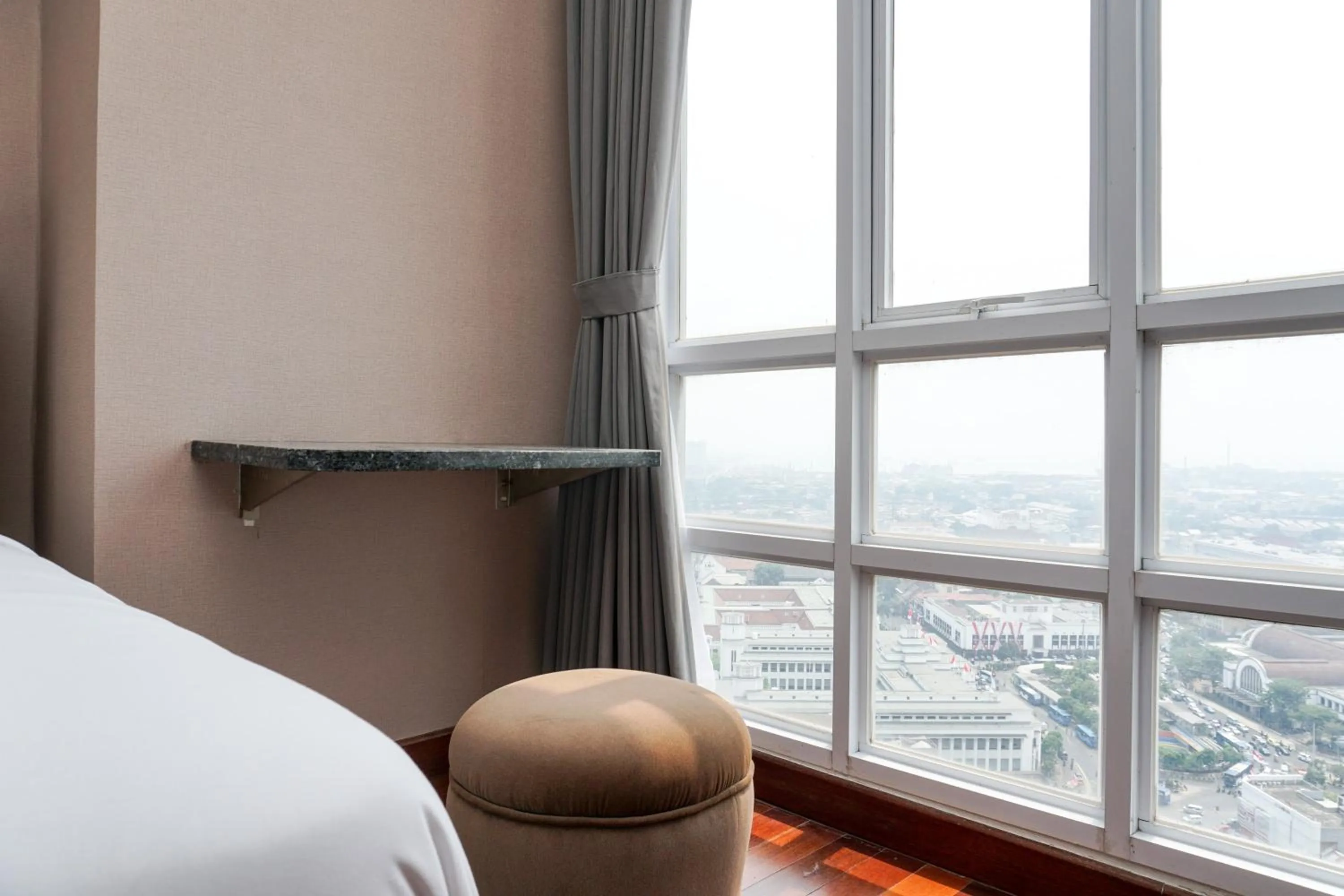 Bed in Fabulous 2BR Apartment Lucky Tower Residence By Travelio