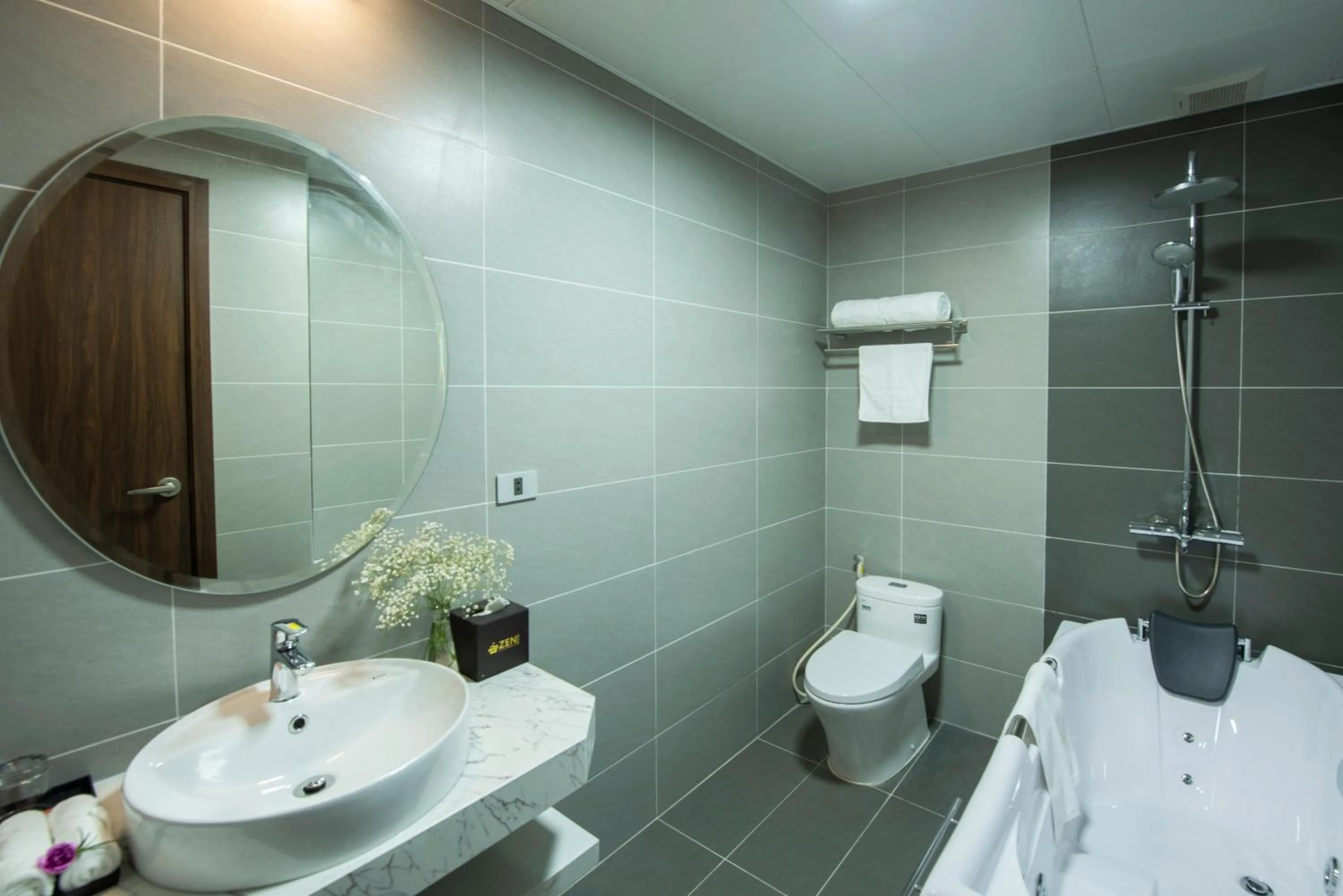 Shower in ZEN RIVERSIDE HOTEL & RESIDENCES