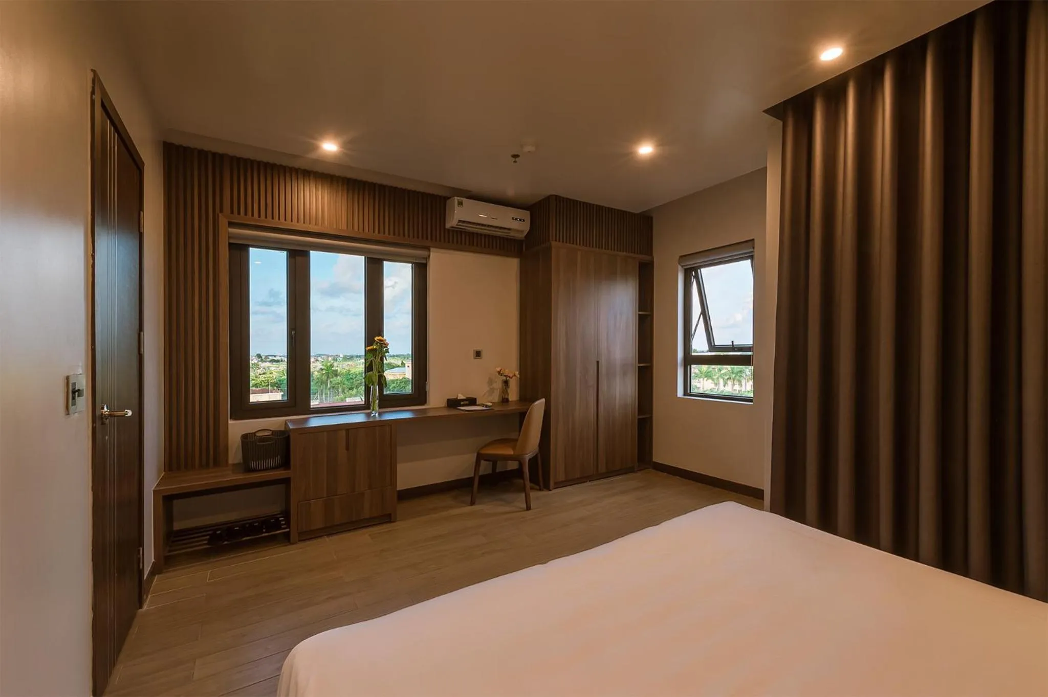 Bed in ZEN RIVERSIDE HOTEL & RESIDENCES