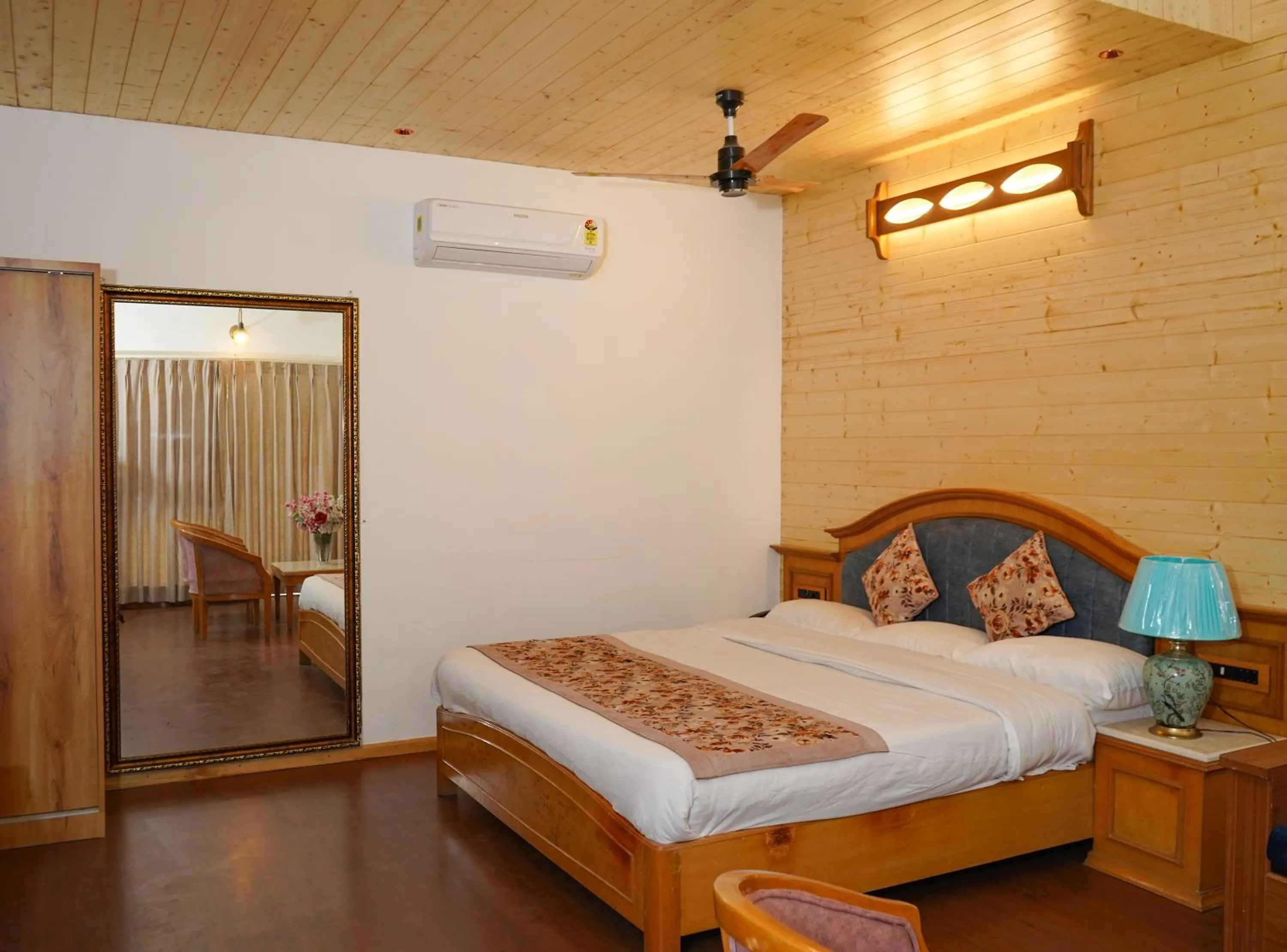 Photo of the whole room, Bed in Neelesh Inn- A Luxury Lake View Hotel- 20 kms from Nainital
