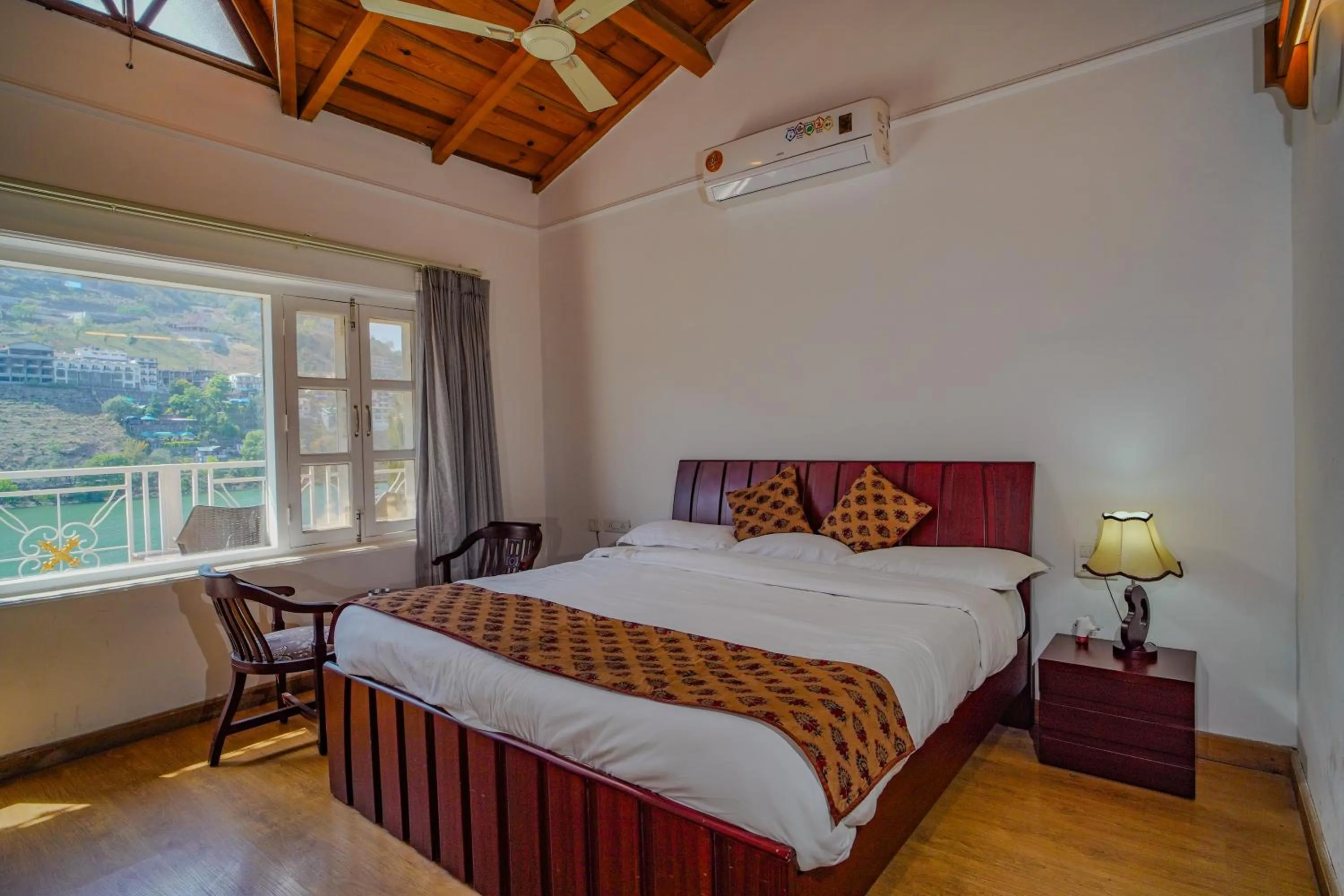 Photo of the whole room, Bed in Neelesh Inn- A Luxury Lake View Hotel- 20 kms from Nainital