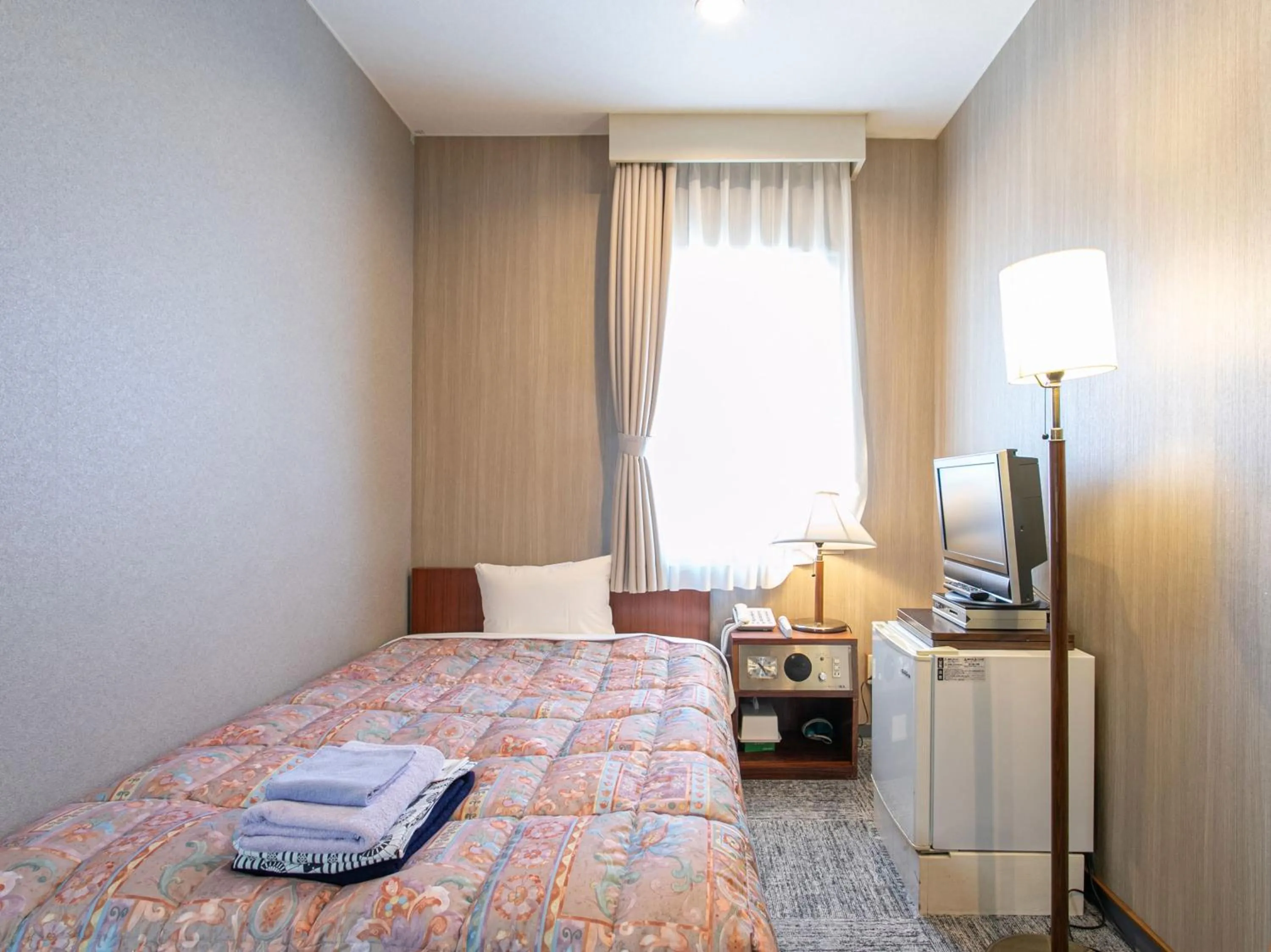 Bed in Aqua Garden Hotel Fukumaru