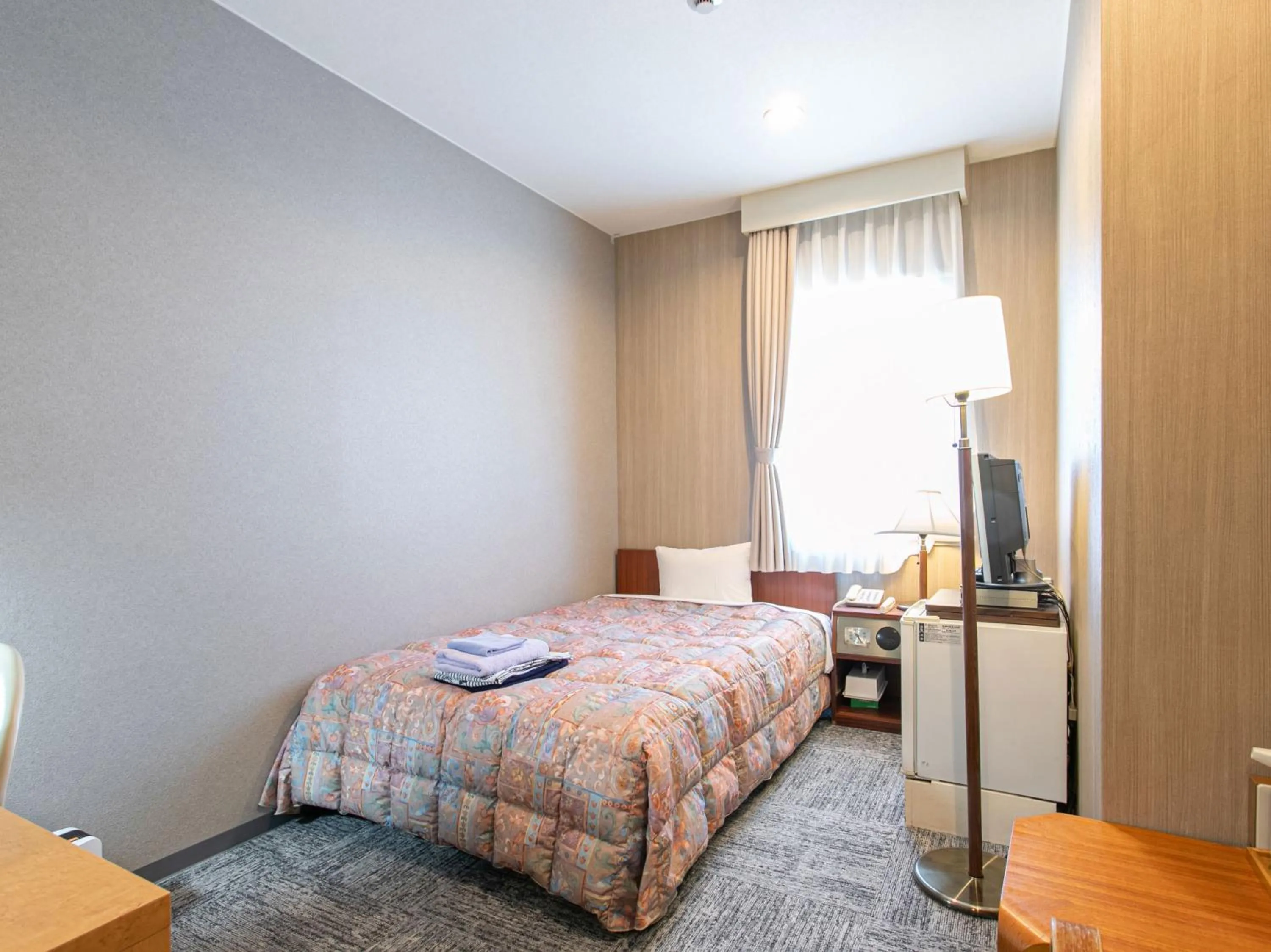 Bed in Aqua Garden Hotel Fukumaru