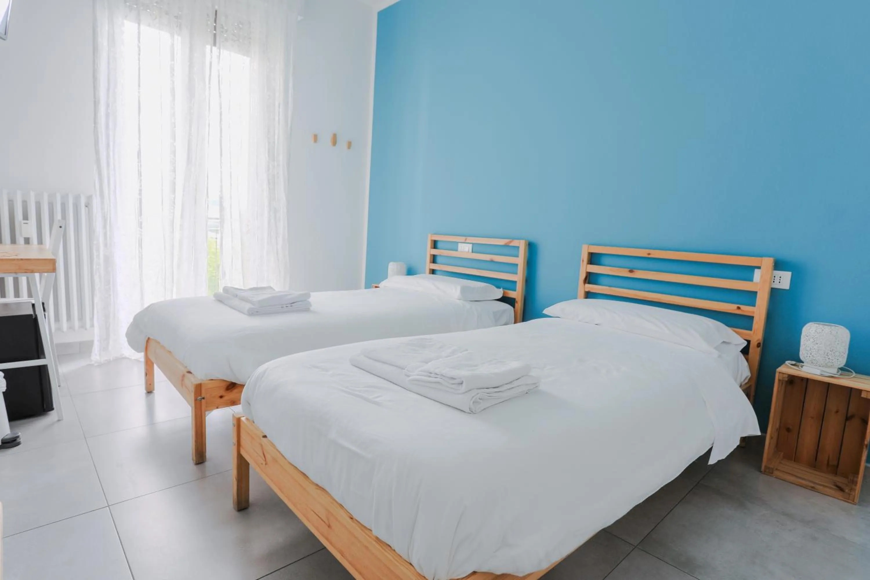 Bed in HOLABOLOGNA Luxury Rooms and Flats