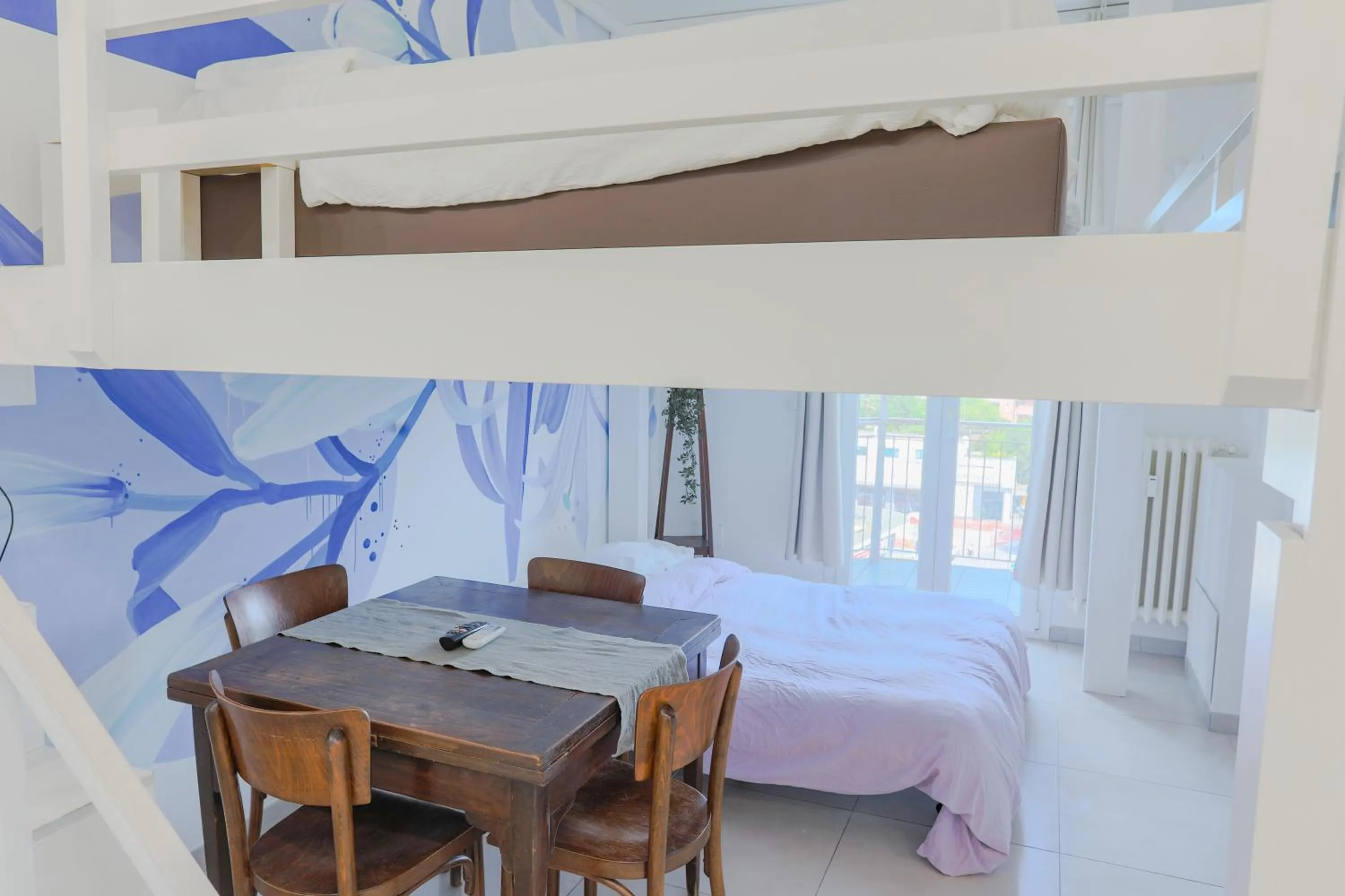 Bed in HOLABOLOGNA Luxury Rooms and Flats