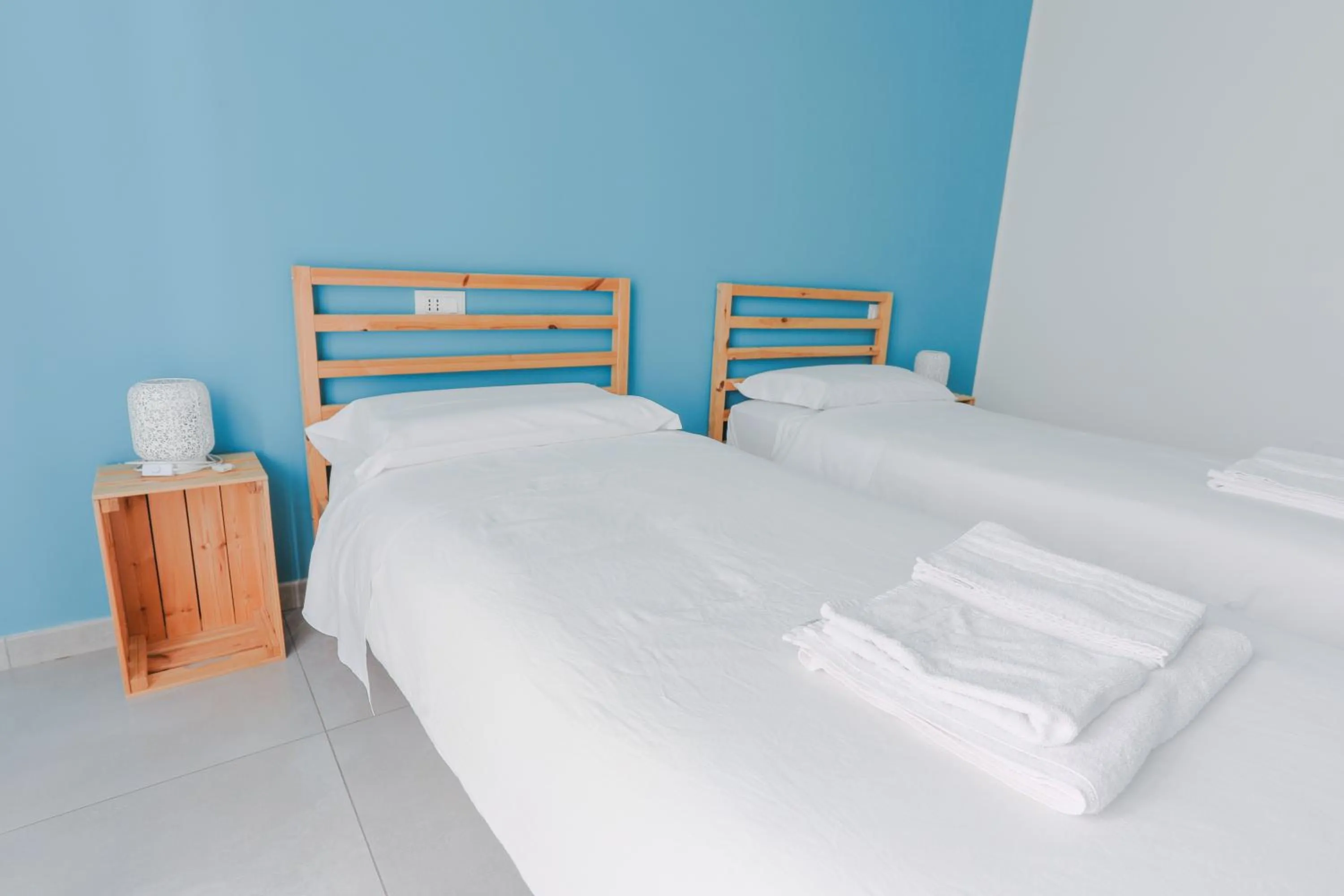 Bed in HOLABOLOGNA Luxury Rooms and Flats