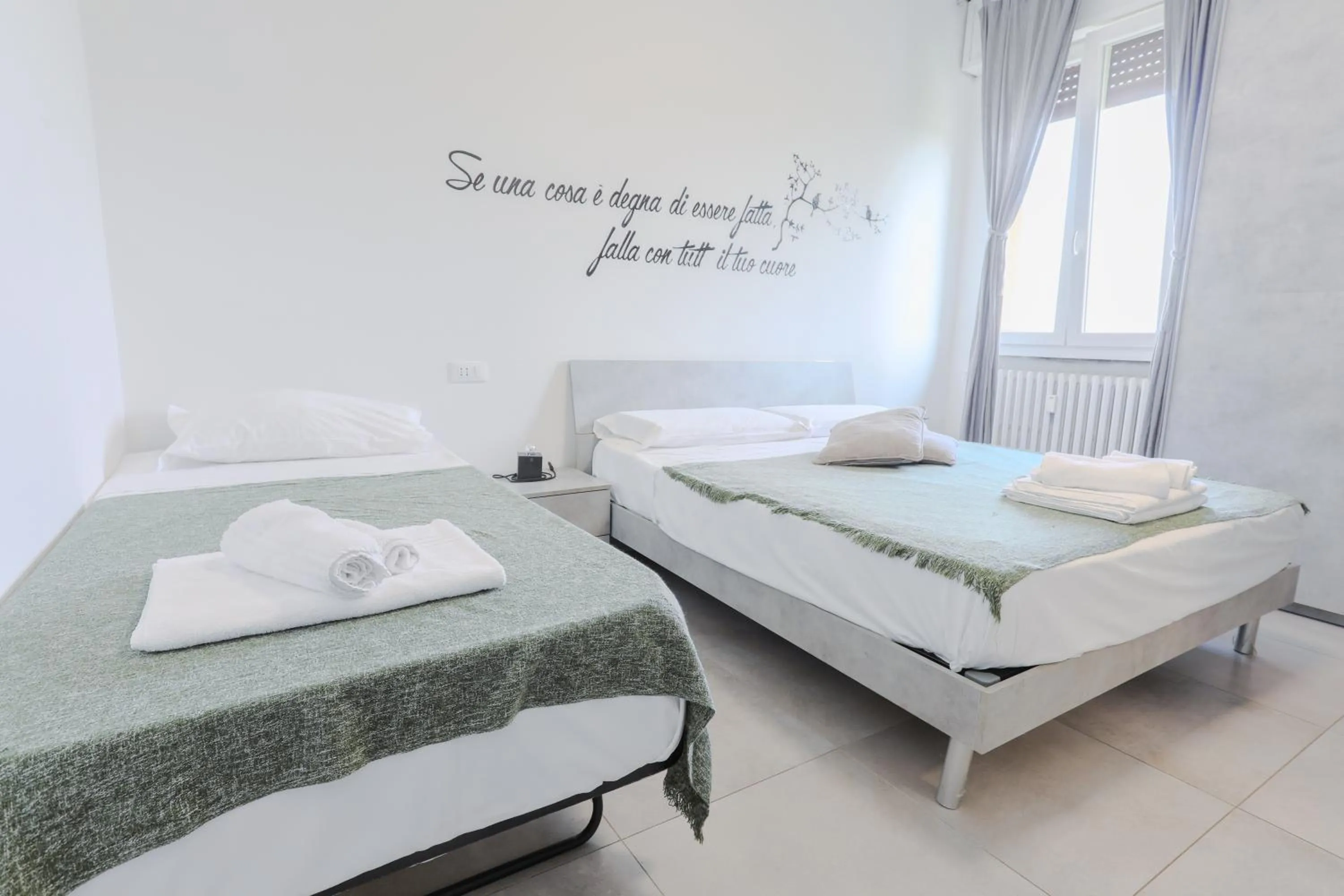 Bed in HOLABOLOGNA Luxury Rooms and Flats