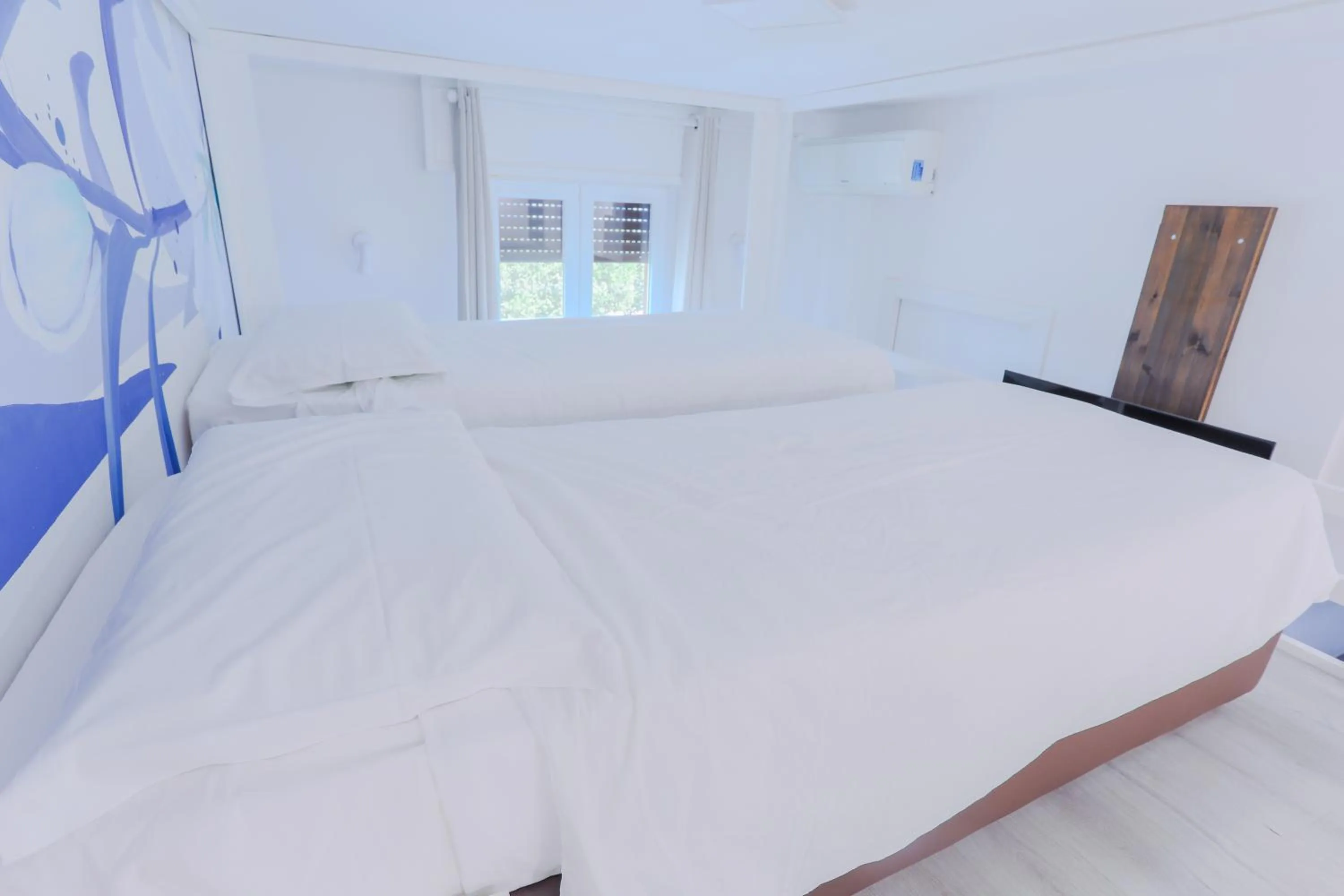 Bed in HOLABOLOGNA Luxury Rooms and Flats