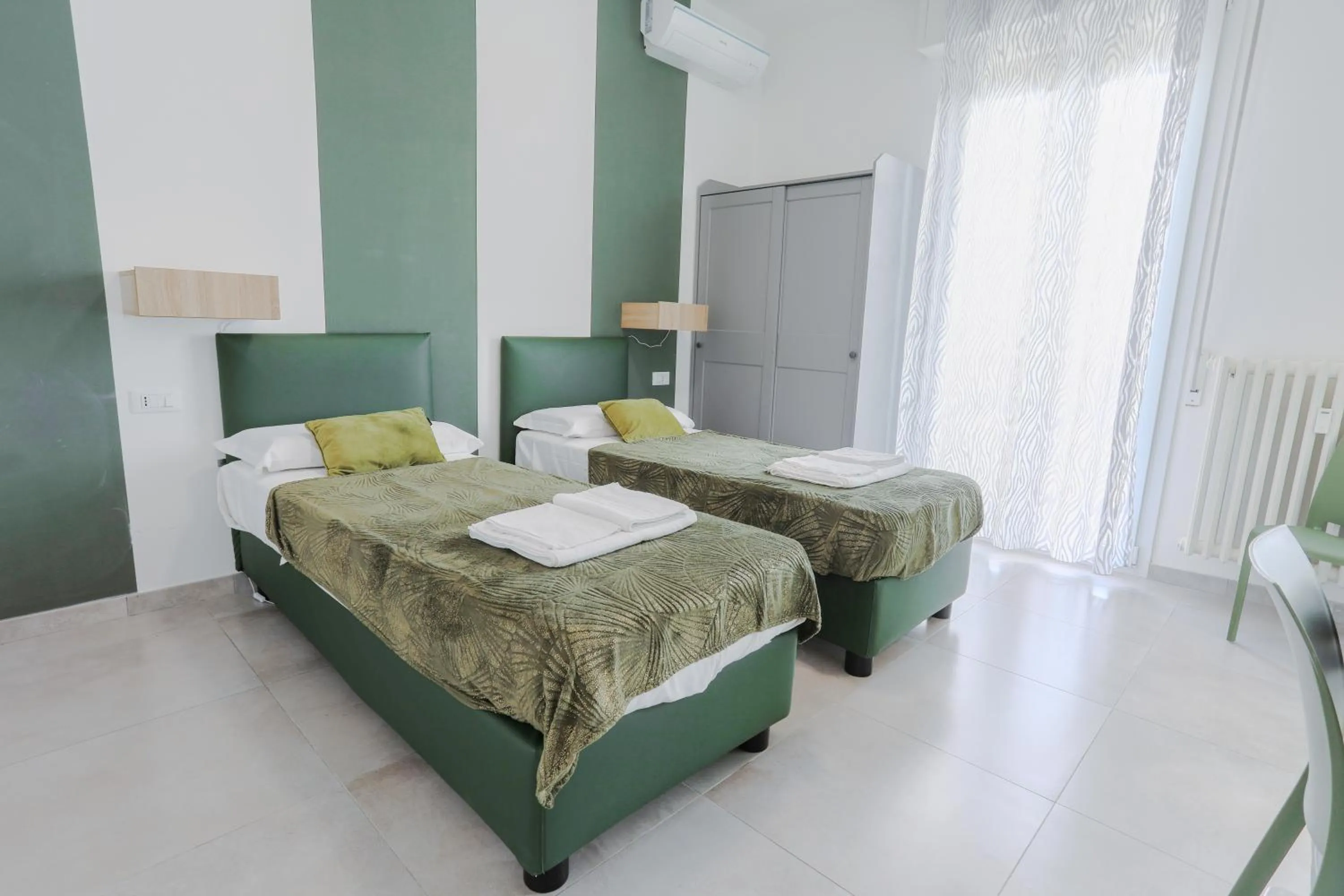 Bed in HOLABOLOGNA Luxury Rooms and Flats