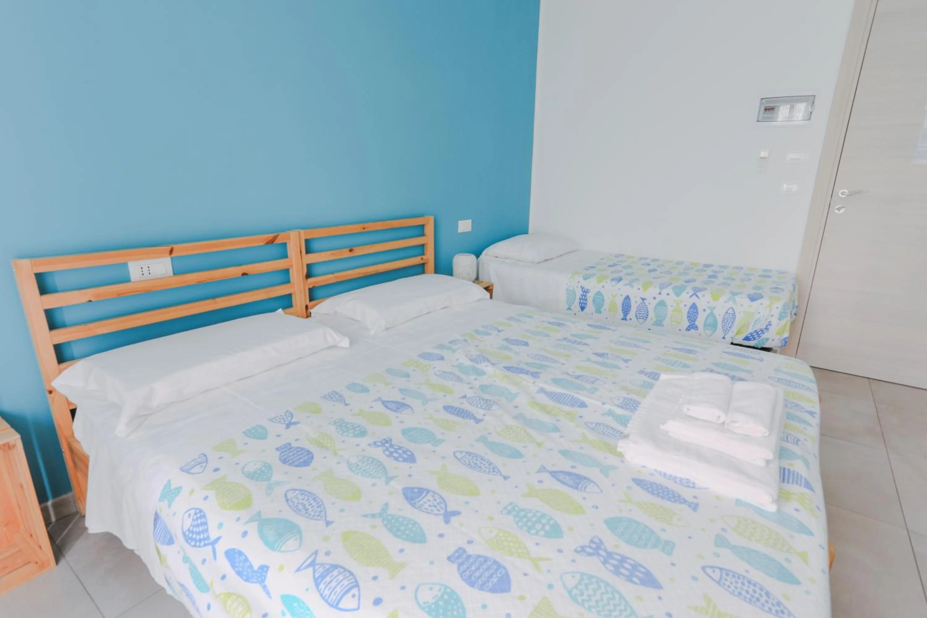 Bed in HOLABOLOGNA Luxury Rooms and Flats