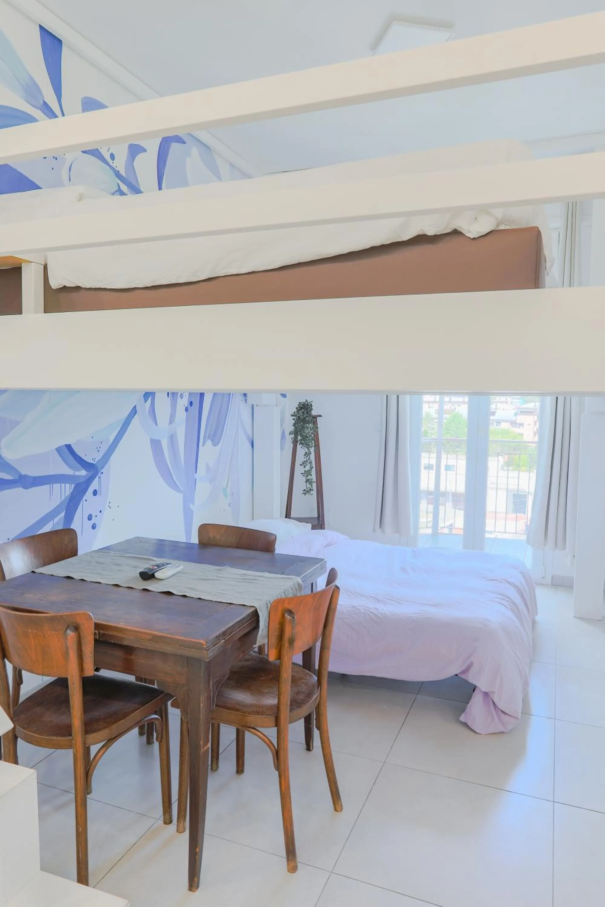 Bed in HOLABOLOGNA Luxury Rooms and Flats