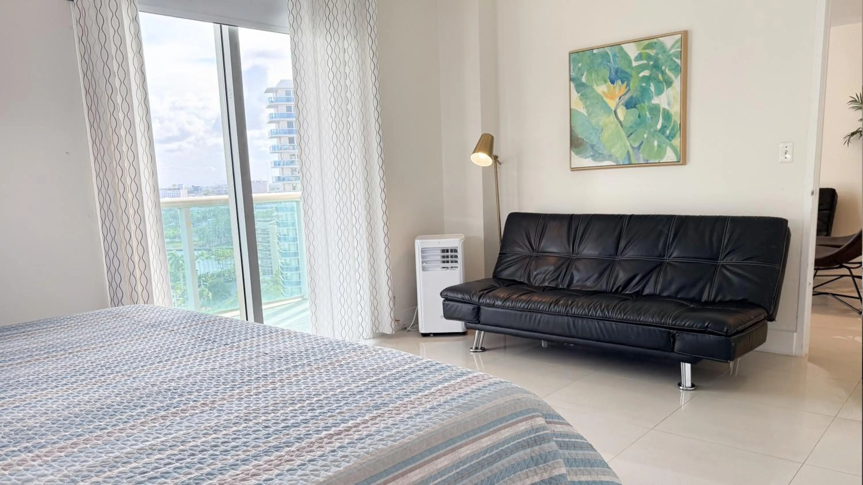 Bedroom, Bed in The Tides Apartments on the beach