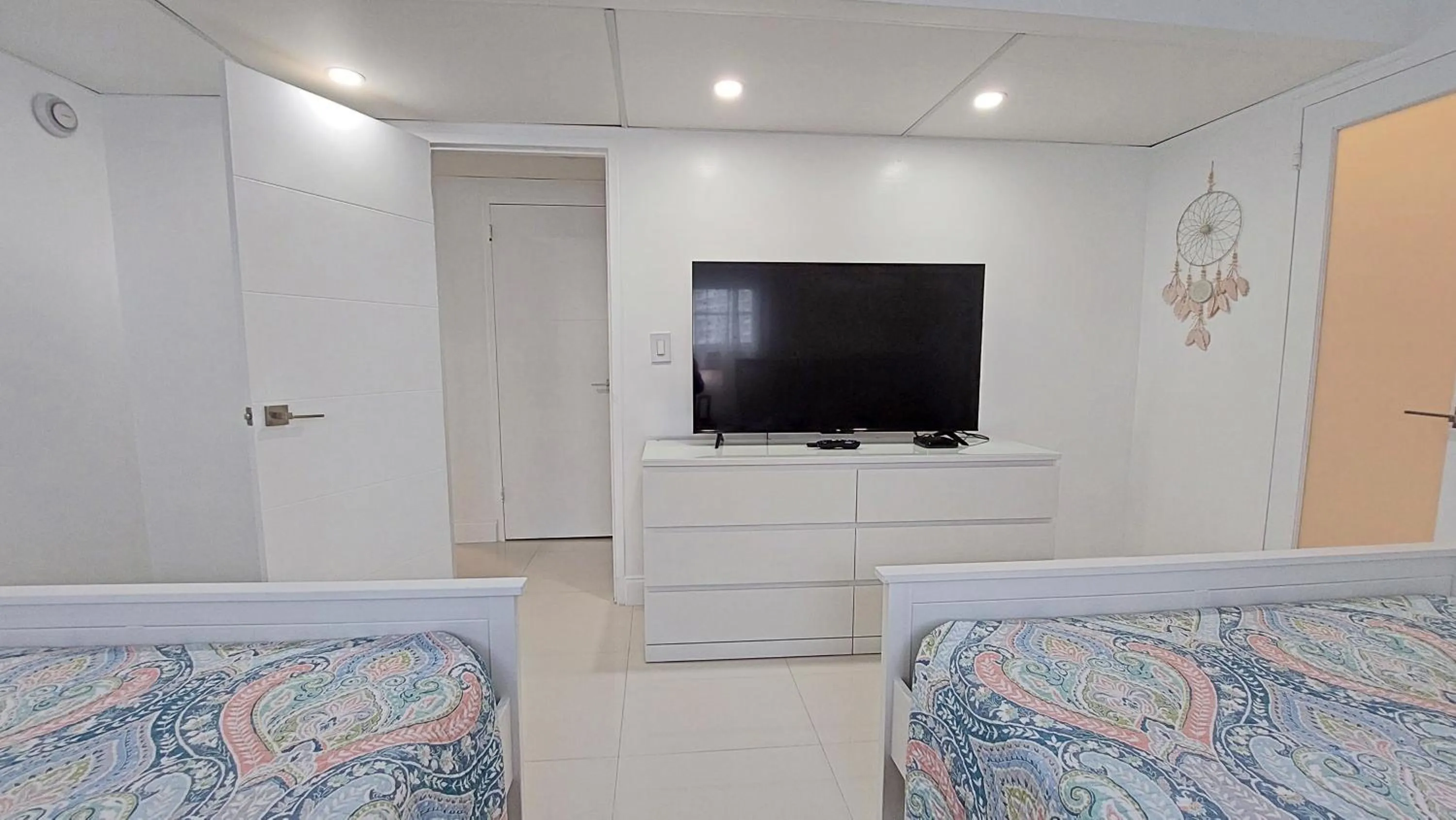 Bedroom, Bed in The Tides Apartments on the beach